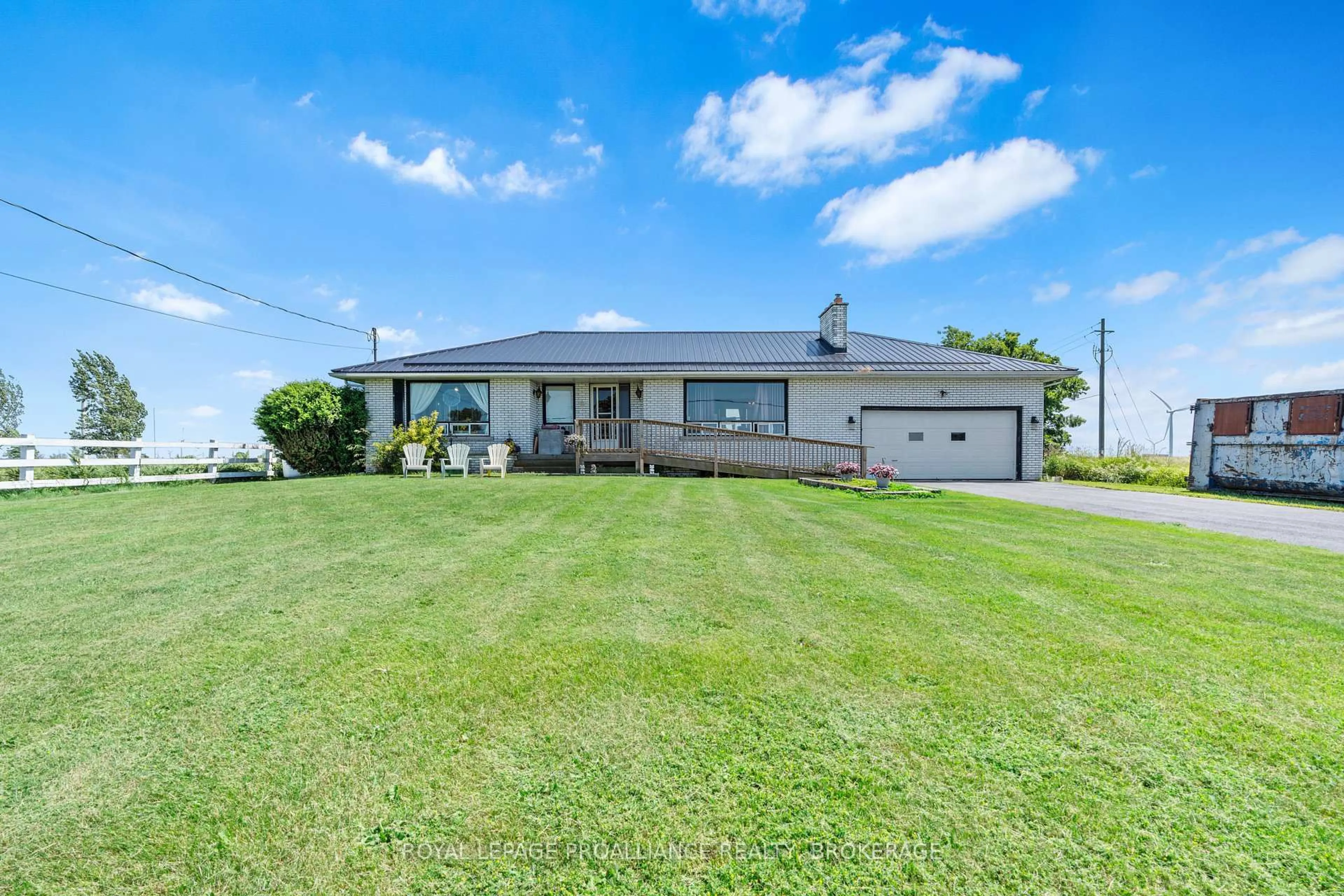 A pic from outside/outdoor area/front of a property/back of a property/a pic from drone, water/lake/river/ocean view for 631 Highway 96, Wolfe Island Ontario K0H 2Y0