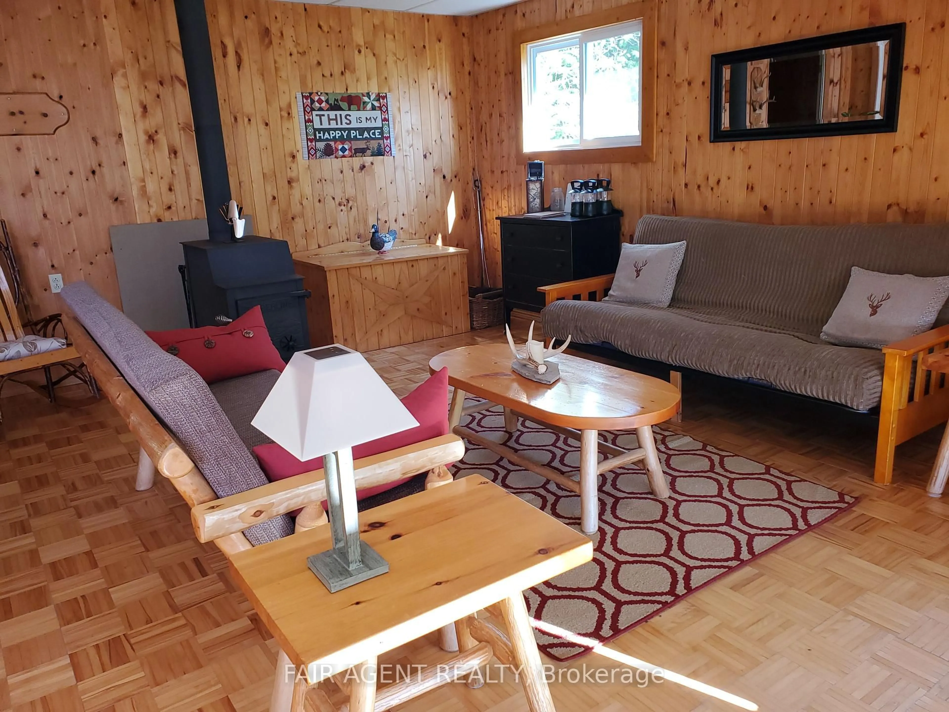 Living room with furniture, wood/laminate floor for 3753 Poplar Rd, Burpee & Mills Ontario P0P 2B0