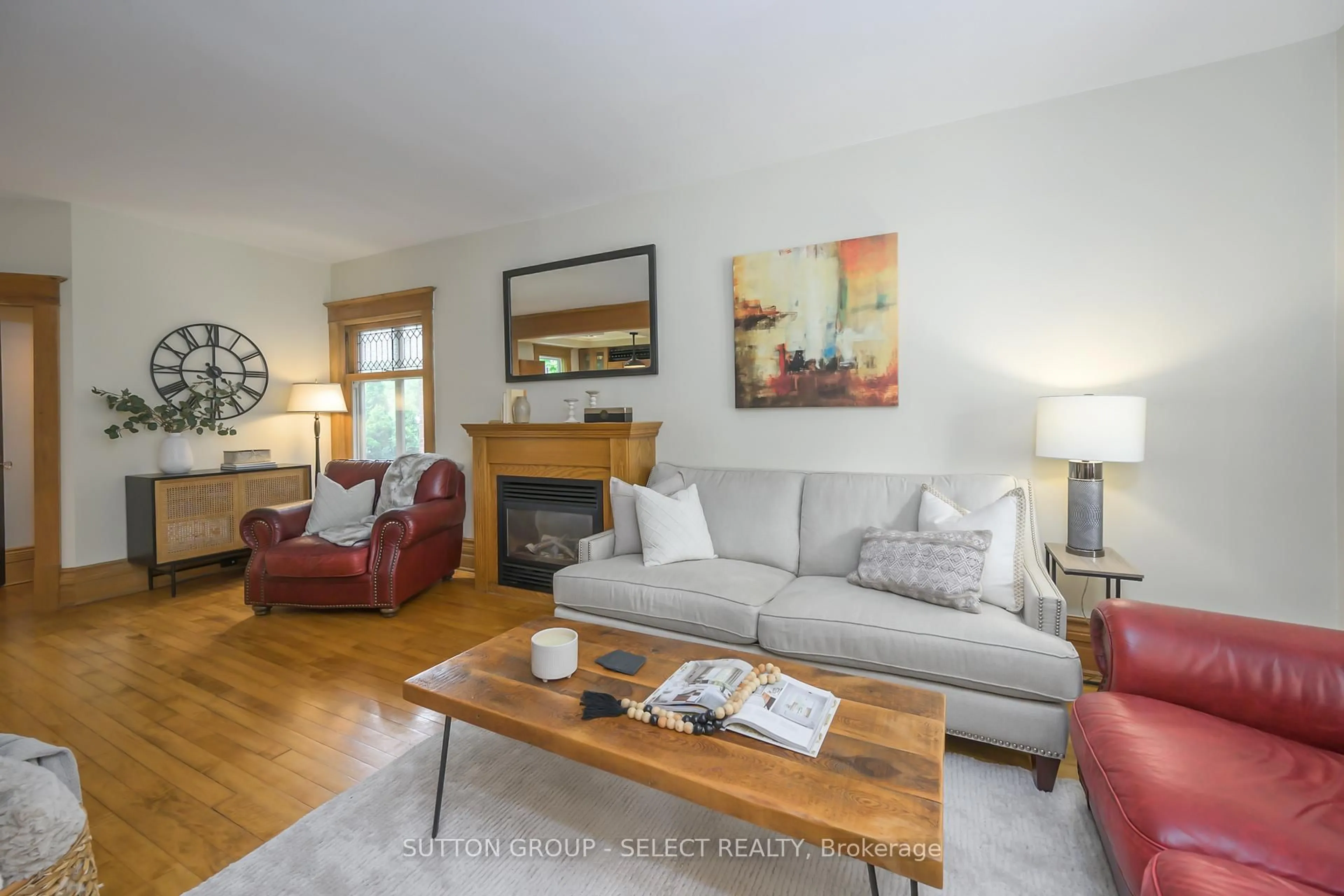 Living room with furniture, wood/laminate floor for 167 Tecumseh Ave, London South Ontario N6C 1S3