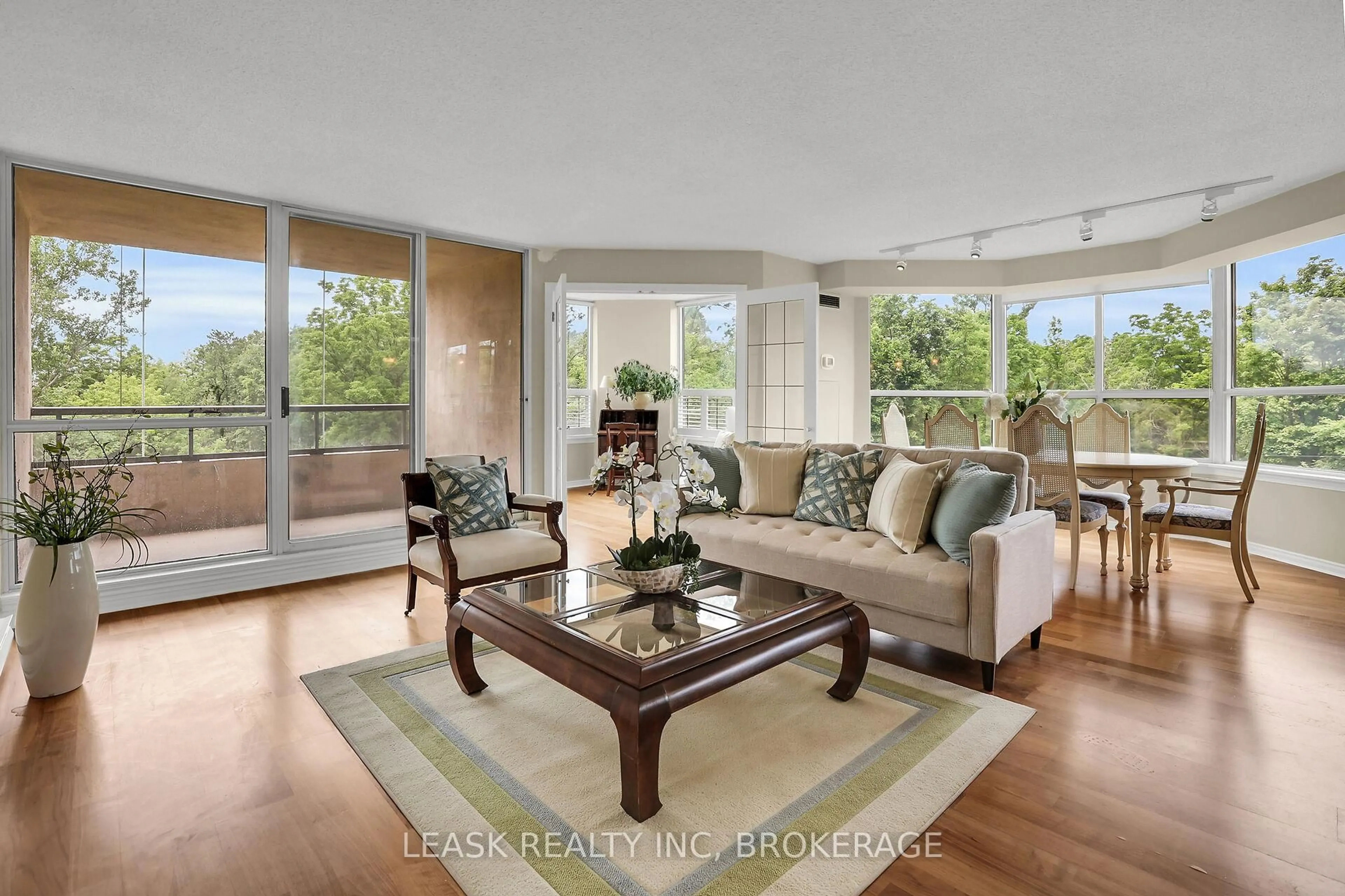 Living room with furniture, wood/laminate floor for 3 Towering Hts Blvd #303, St. Catharines Ontario L2T 4A4