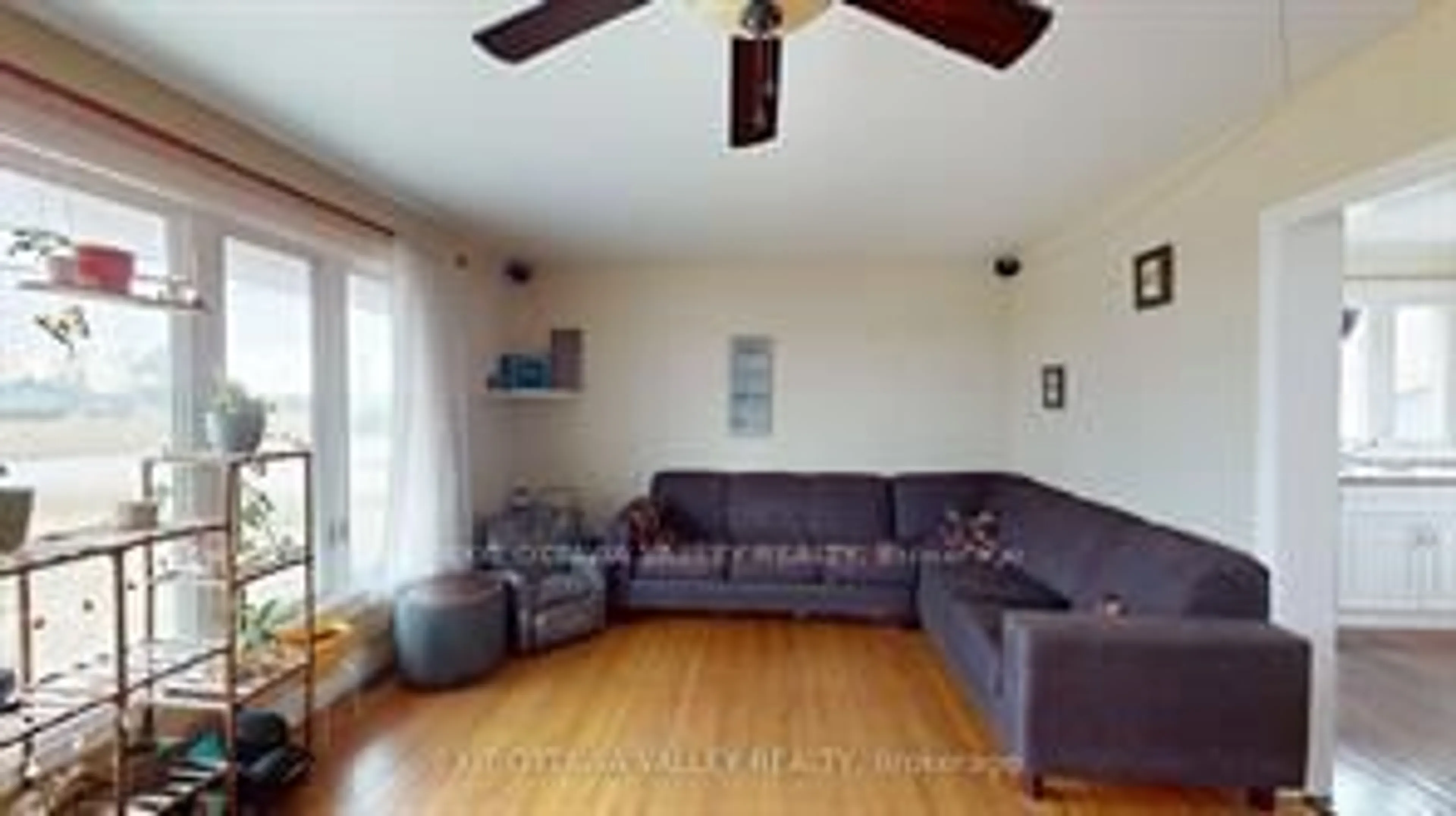 Living room with furniture, wood/laminate floor for 2047 Lapasse Rd, Beachburg Ontario K0J 1C0