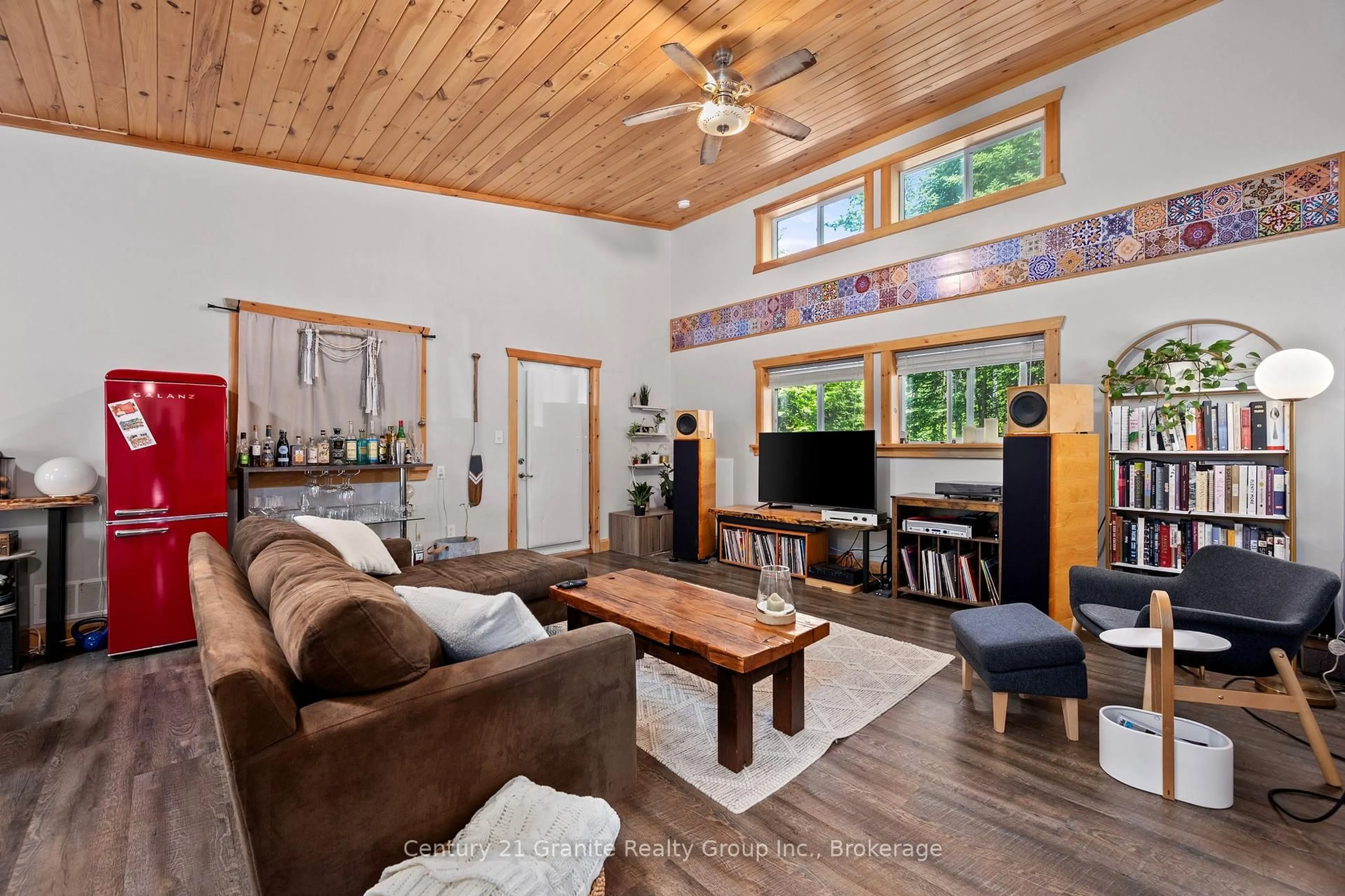Living room with furniture, wood/laminate floor for 51 FARMCREST Ave, Dysart et al Ontario K0M 1S0