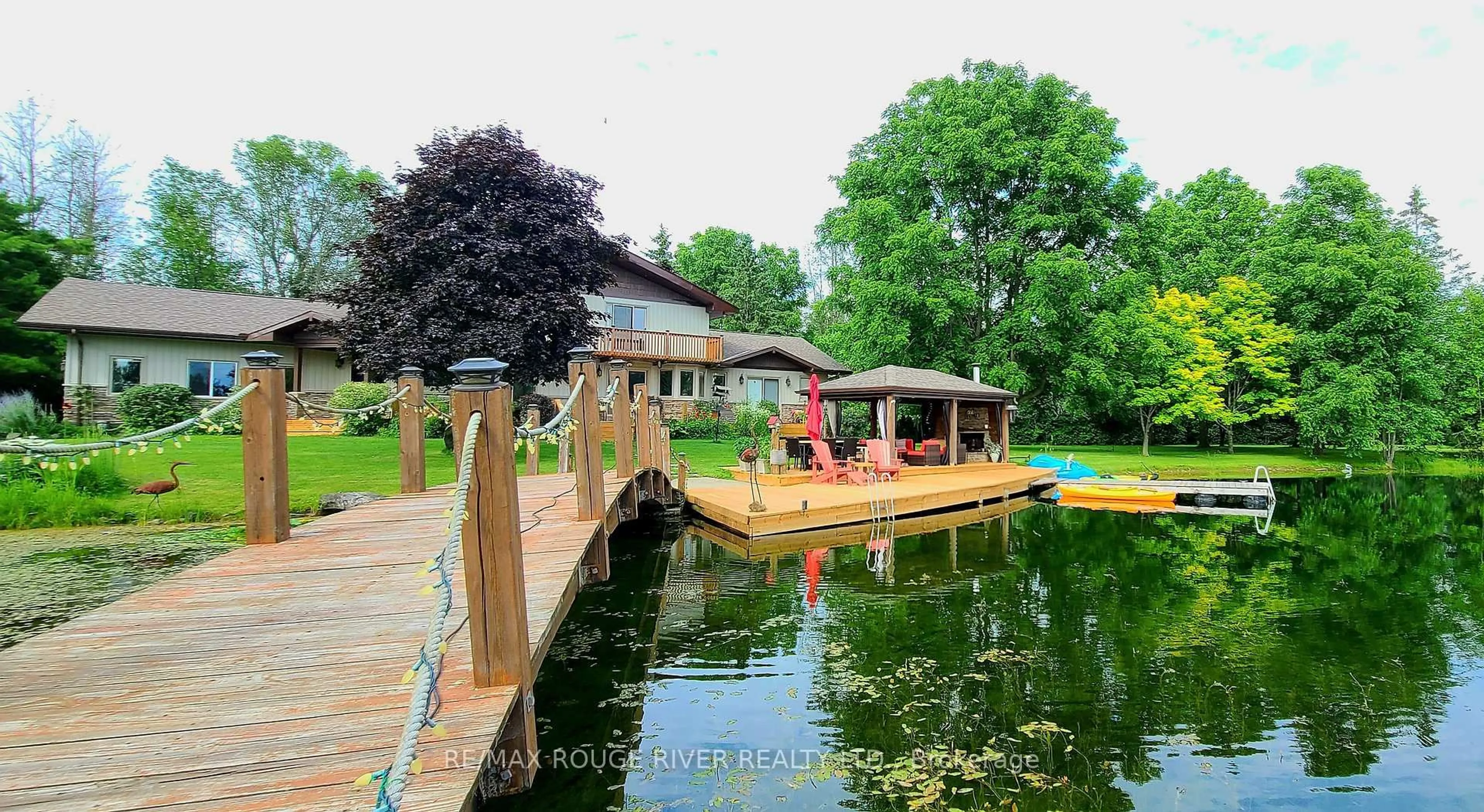A pic from outside/outdoor area/front of a property/back of a property/a pic from drone, water/lake/river/ocean view for 908 County Rd 42 Rd, Athens Ontario K0E 1B0