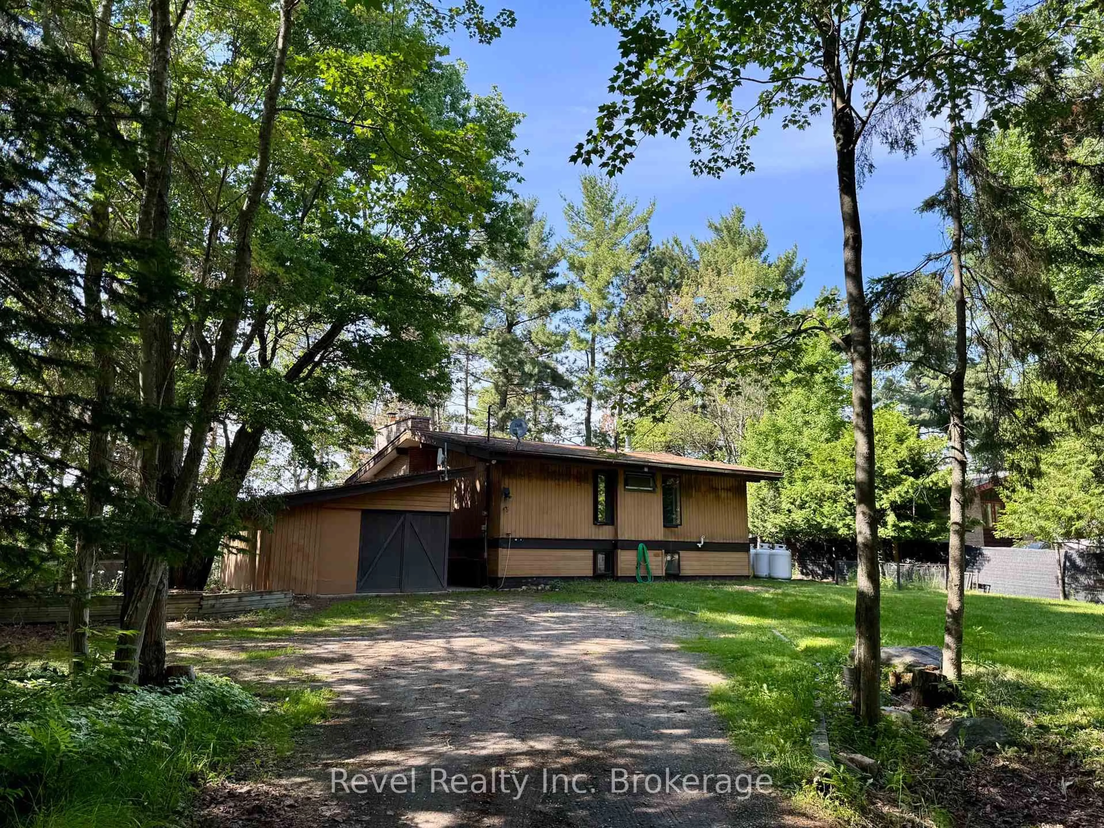 A pic from outside/outdoor area/front of a property/back of a property/a pic from drone, forest/trees view for 15 Knutson Crt, East Ferris Ontario P0H 1K0
