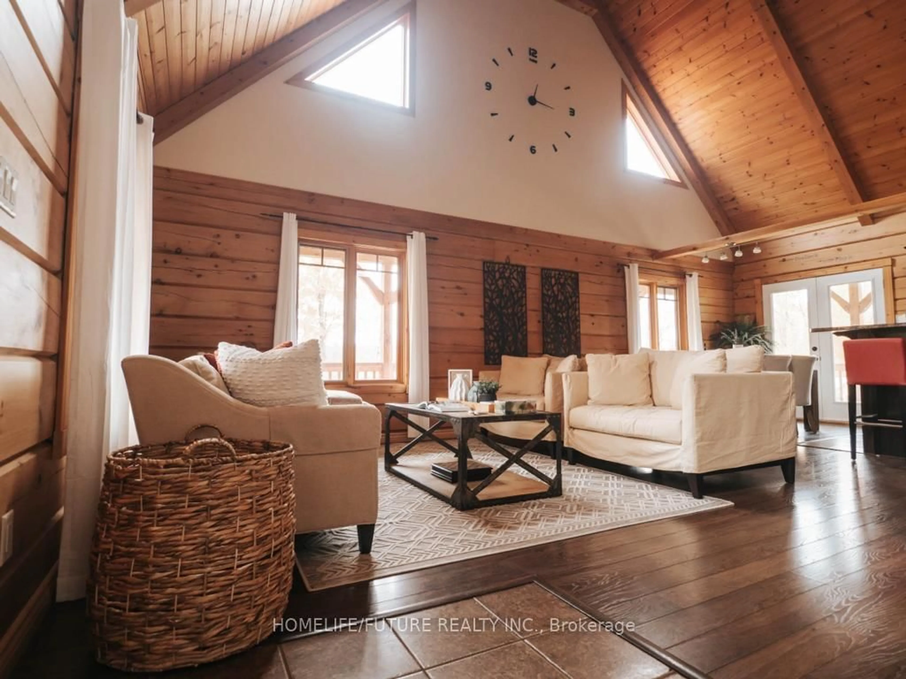 Living room with furniture, wood/laminate floor for 79 Quilan Rd, Madoc Ontario K0K 2K0