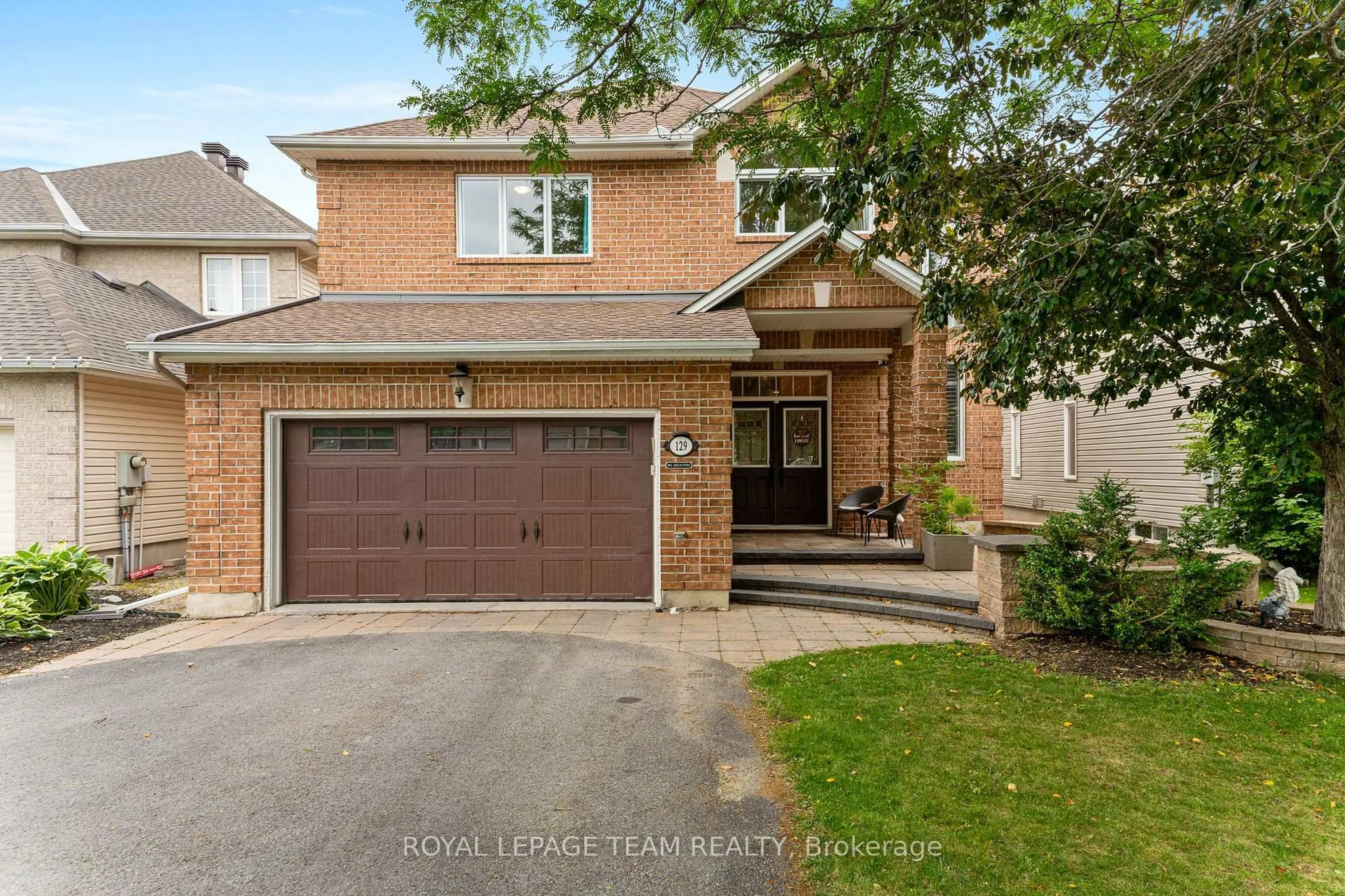 Home with brick exterior material, street for 129 Osprey Cres, Kanata Ontario K2M 2Z9