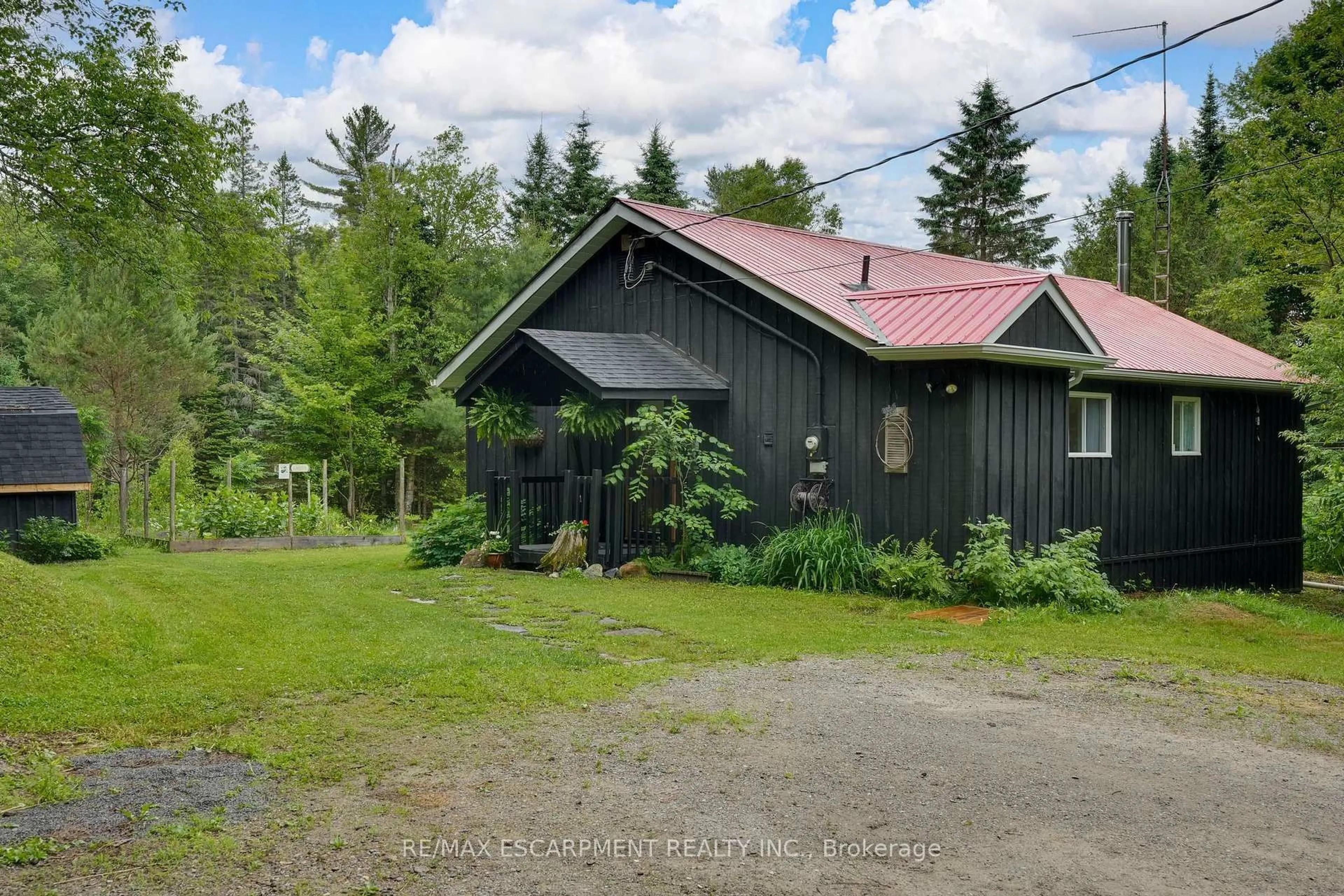 A pic from outside/outdoor area/front of a property/back of a property/a pic from drone, street for 223 Laneige Ave, Huntsville Ontario P0B 1L0