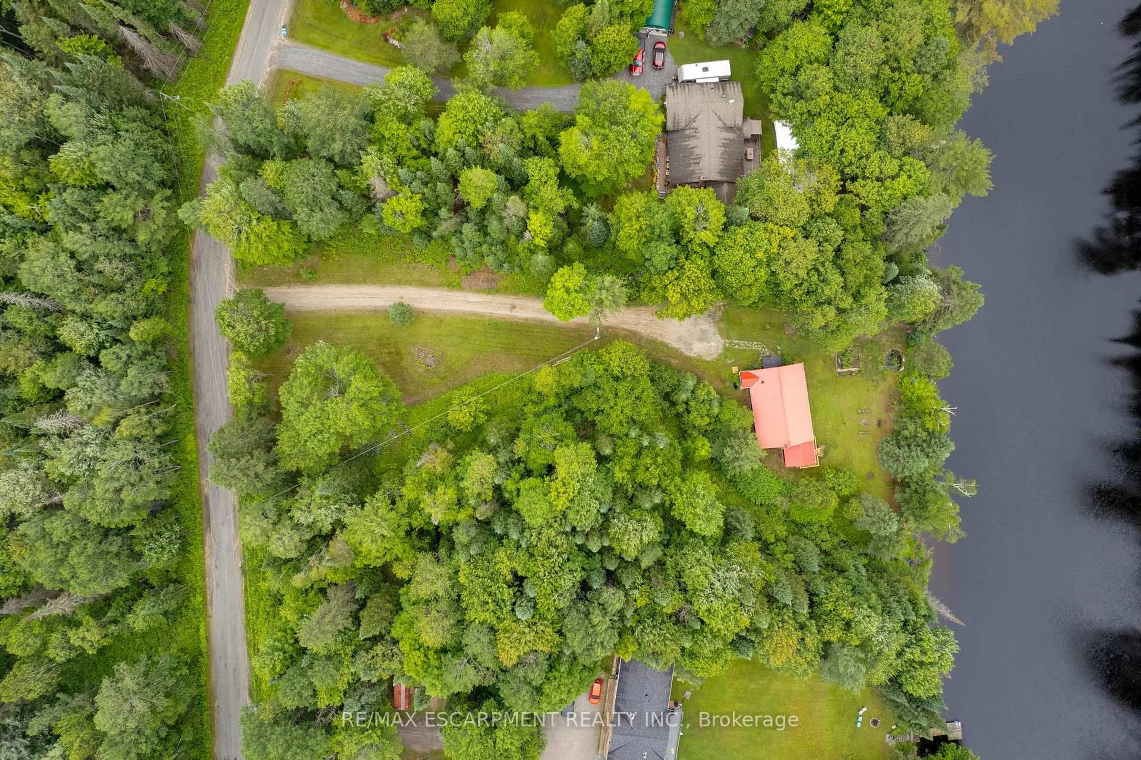 A pic from outside/outdoor area/front of a property/back of a property/a pic from drone, forest/trees view for 223 Laneige Ave, Huntsville Ontario P0B 1L0
