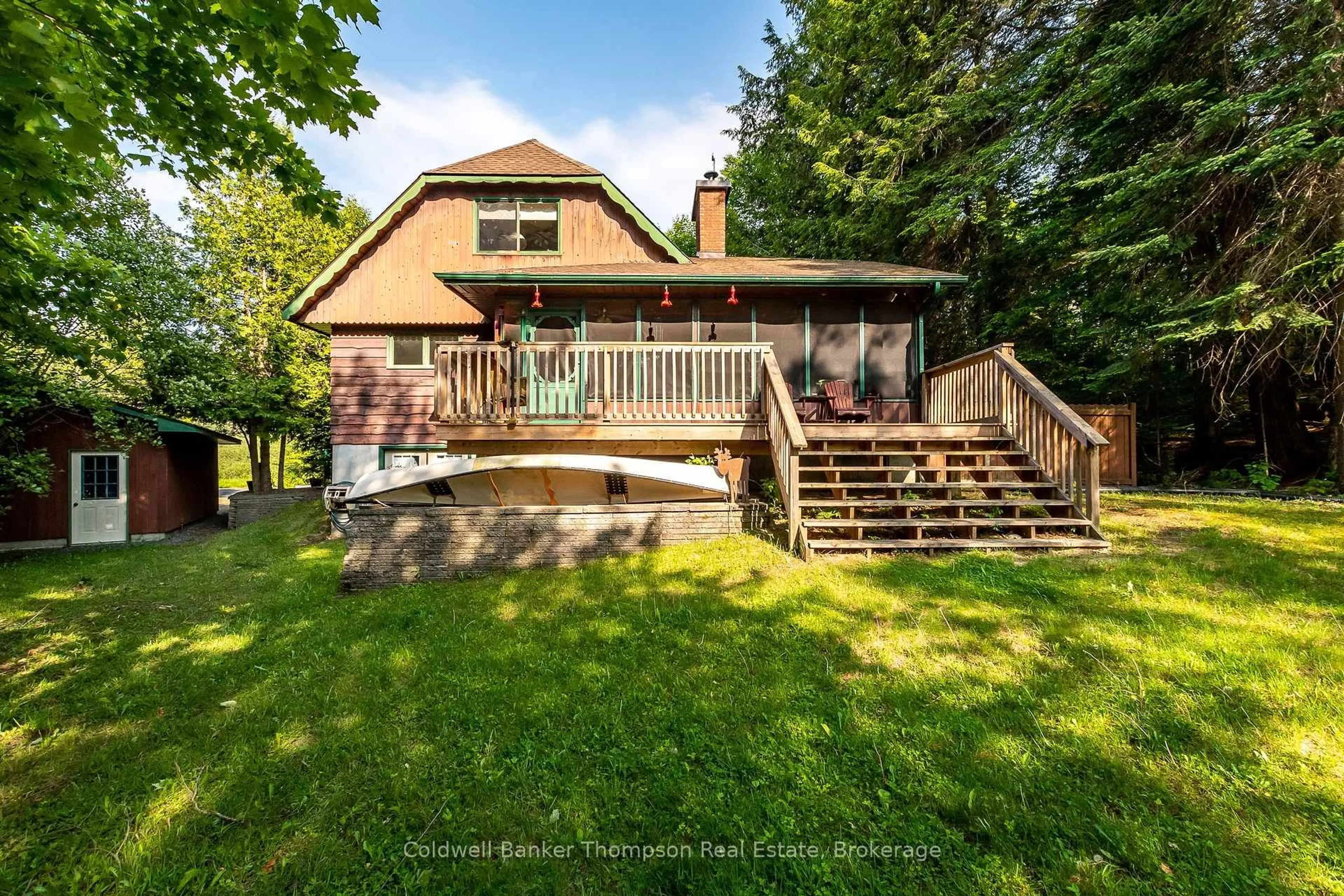 A pic from outside/outdoor area/front of a property/back of a property/a pic from drone, water/lake/river/ocean view for 215 Ena Dr, Huntsville Ontario P1H 2J4
