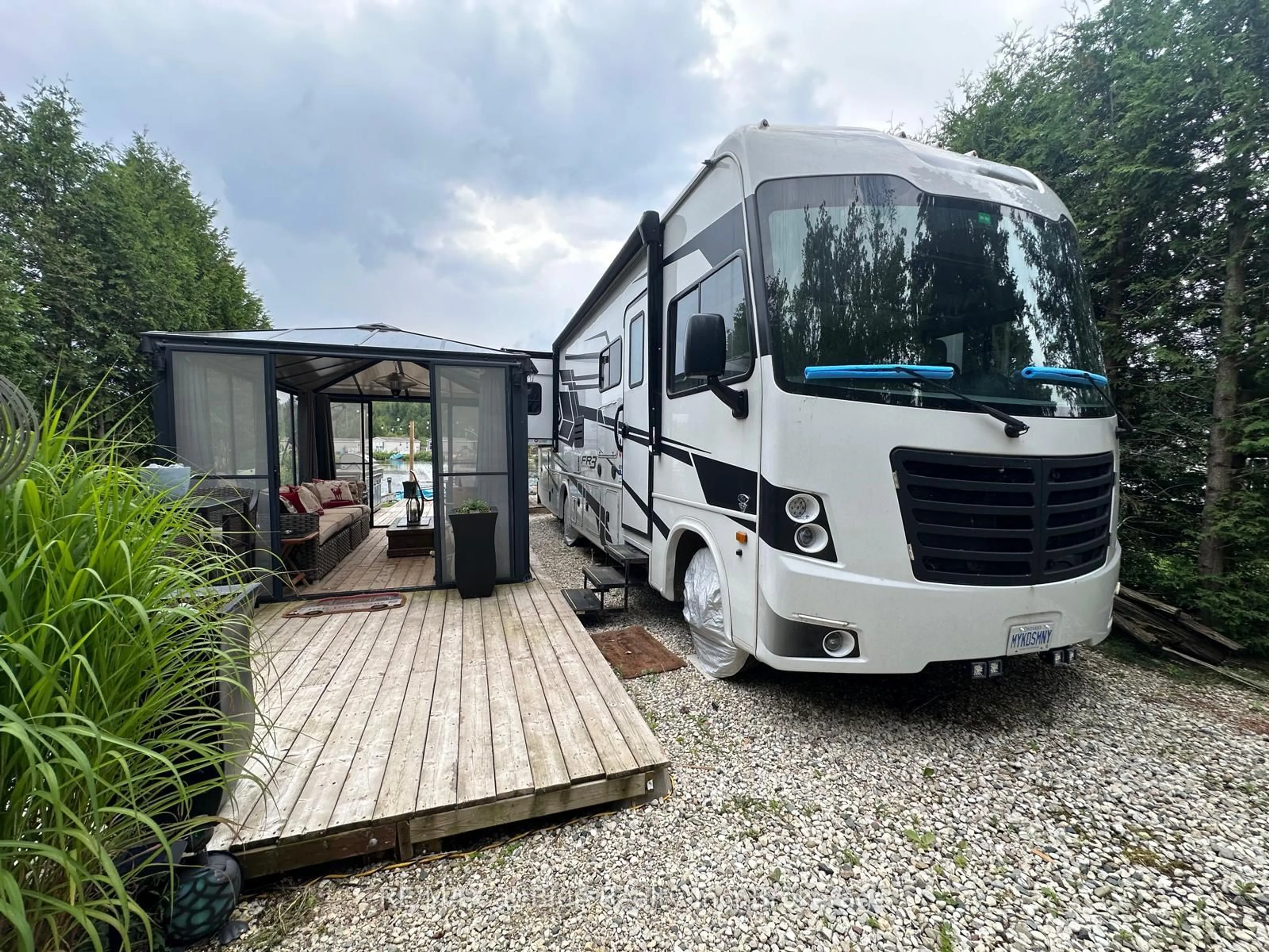 A pic from outside/outdoor area/front of a property/back of a property/a pic from drone, street for 7489 SIDEROAD 5 #Tamarak 92, Wellington North Ontario N0G 2L0
