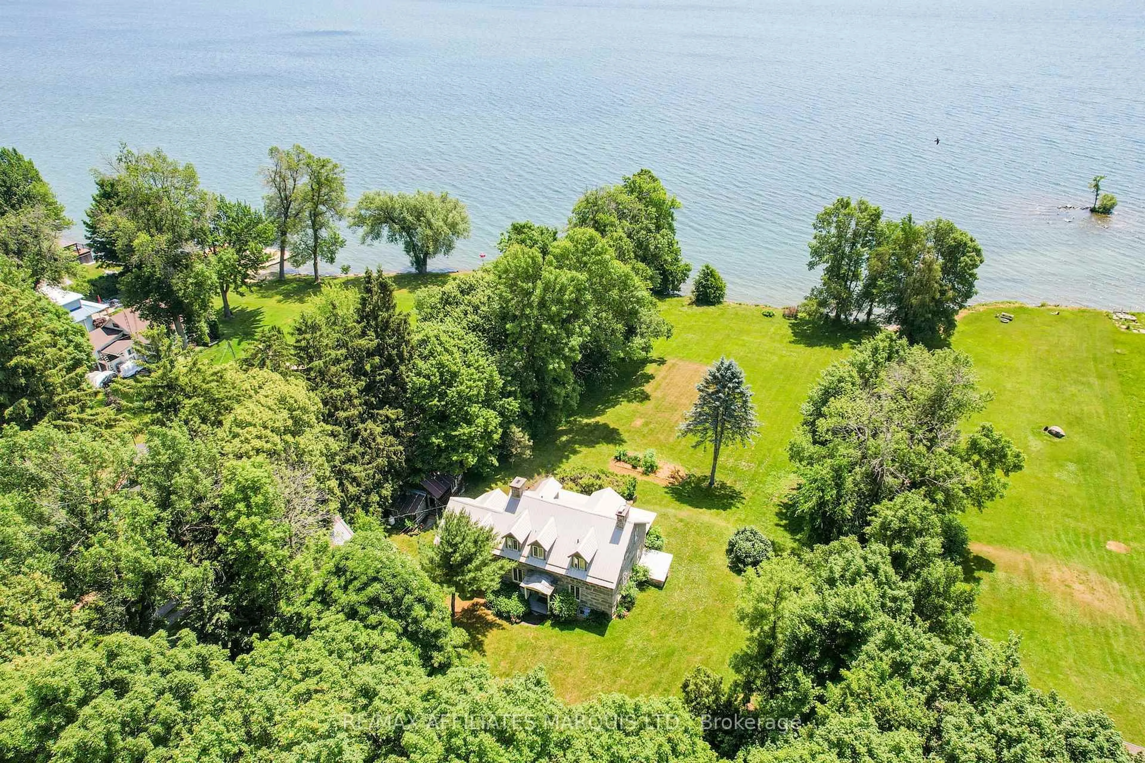 A pic from outside/outdoor area/front of a property/back of a property/a pic from drone, water/lake/river/ocean view for 20824 South Service Rd, South Glengarry Ontario K0C 1N0