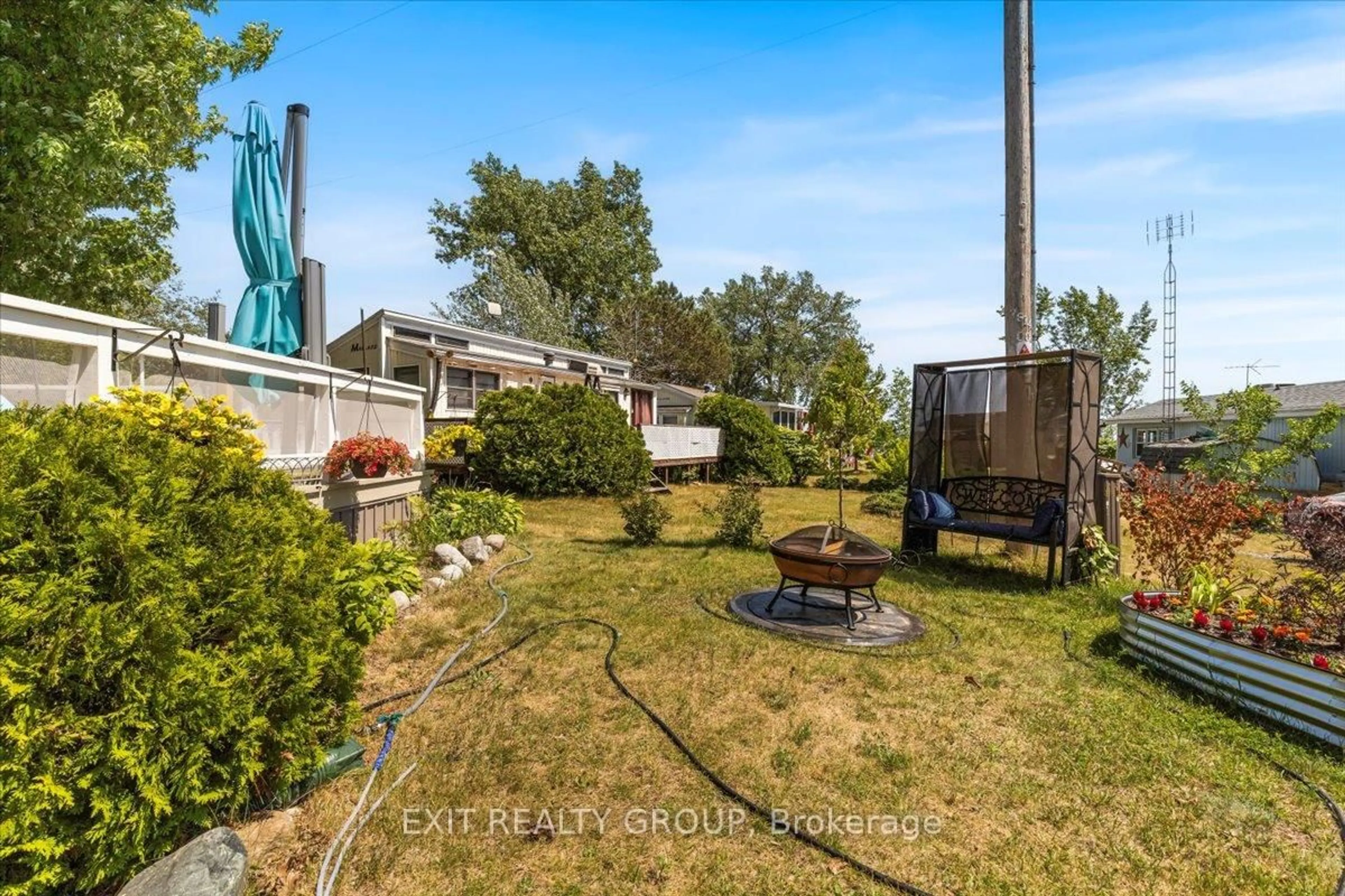 A pic from outside/outdoor area/front of a property/back of a property/a pic from drone, water/lake/river/ocean view for 116 Cedardale Rd #1, Brighton Ontario K0K 1H0
