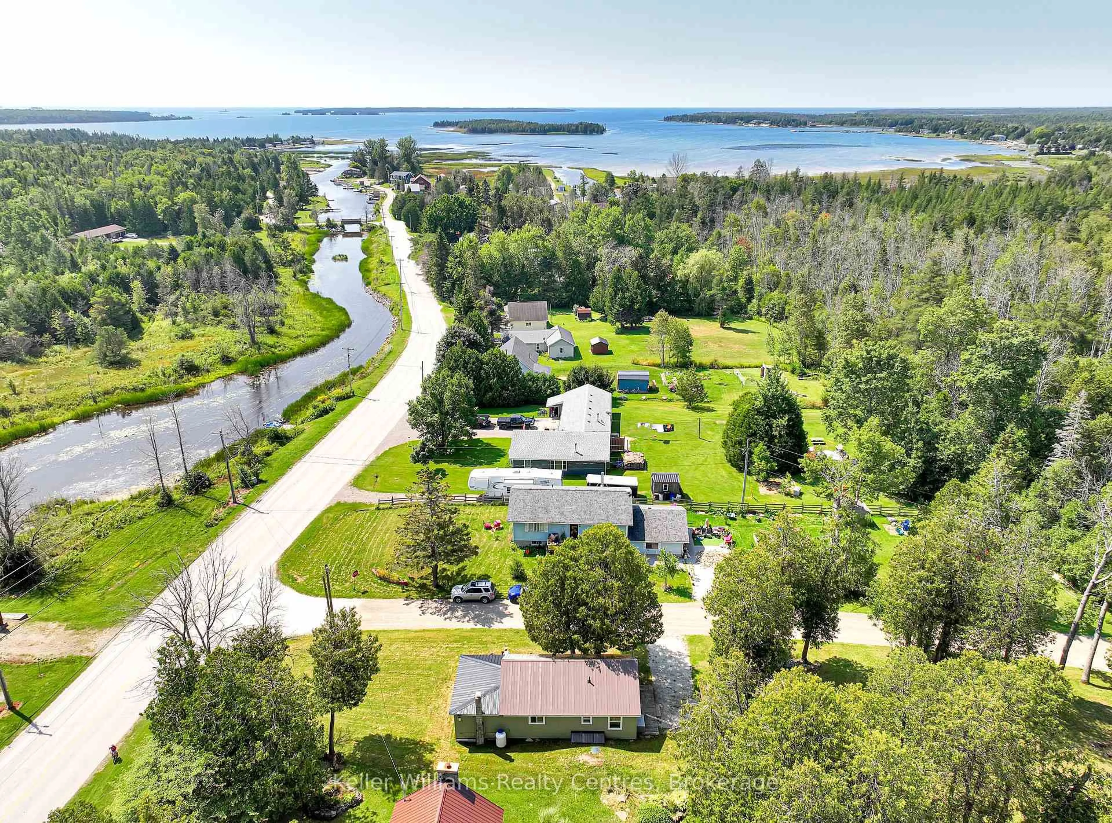 A pic from outside/outdoor area/front of a property/back of a property/a pic from drone, water/lake/river/ocean view for 4 Woodstock Ave, Northern Bruce Peninsula Ontario N0H 2M0