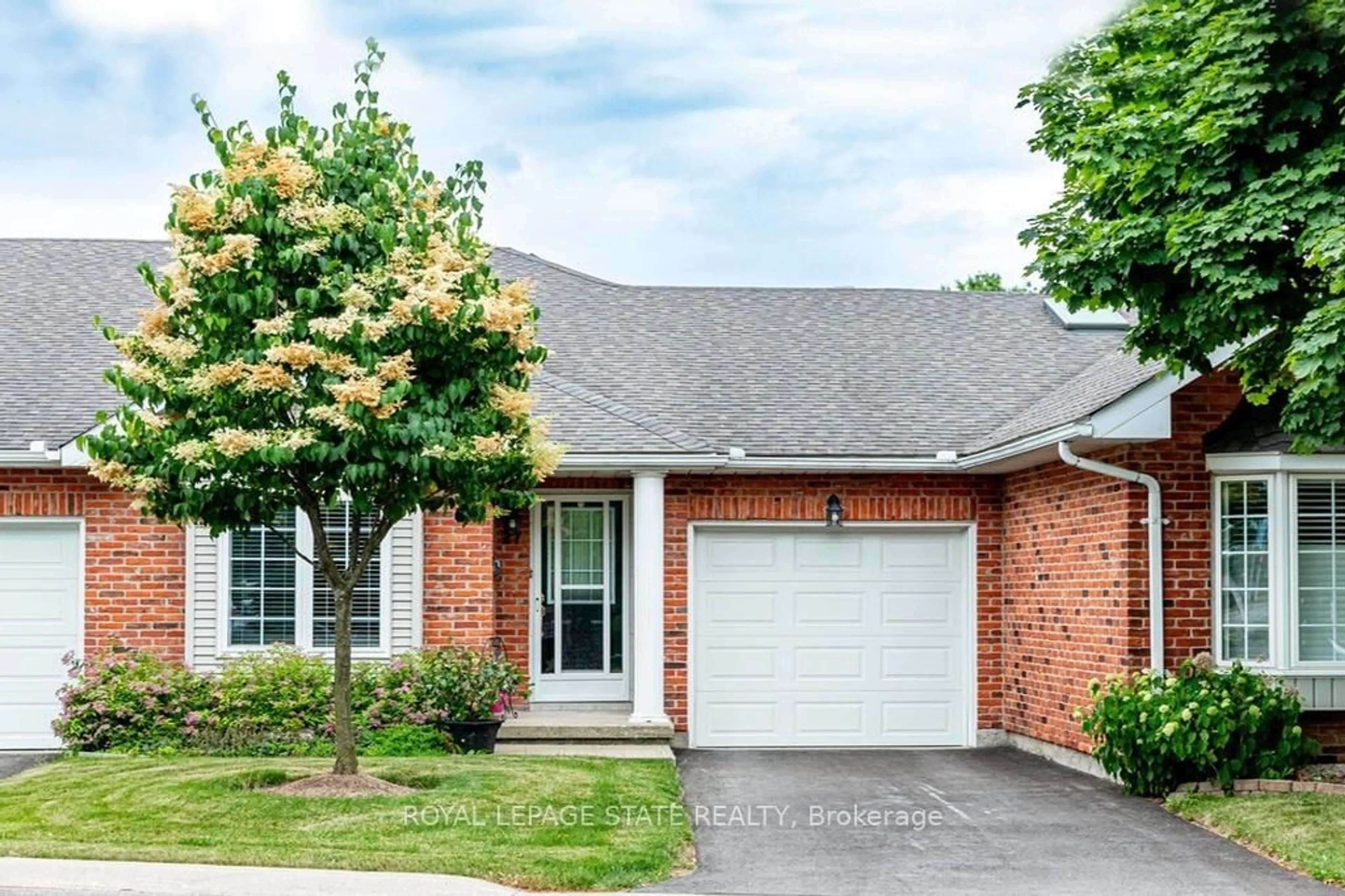 Home with brick exterior material, street for 20 Meadowlands Blvd #27, Hamilton Ontario L9K 1J5