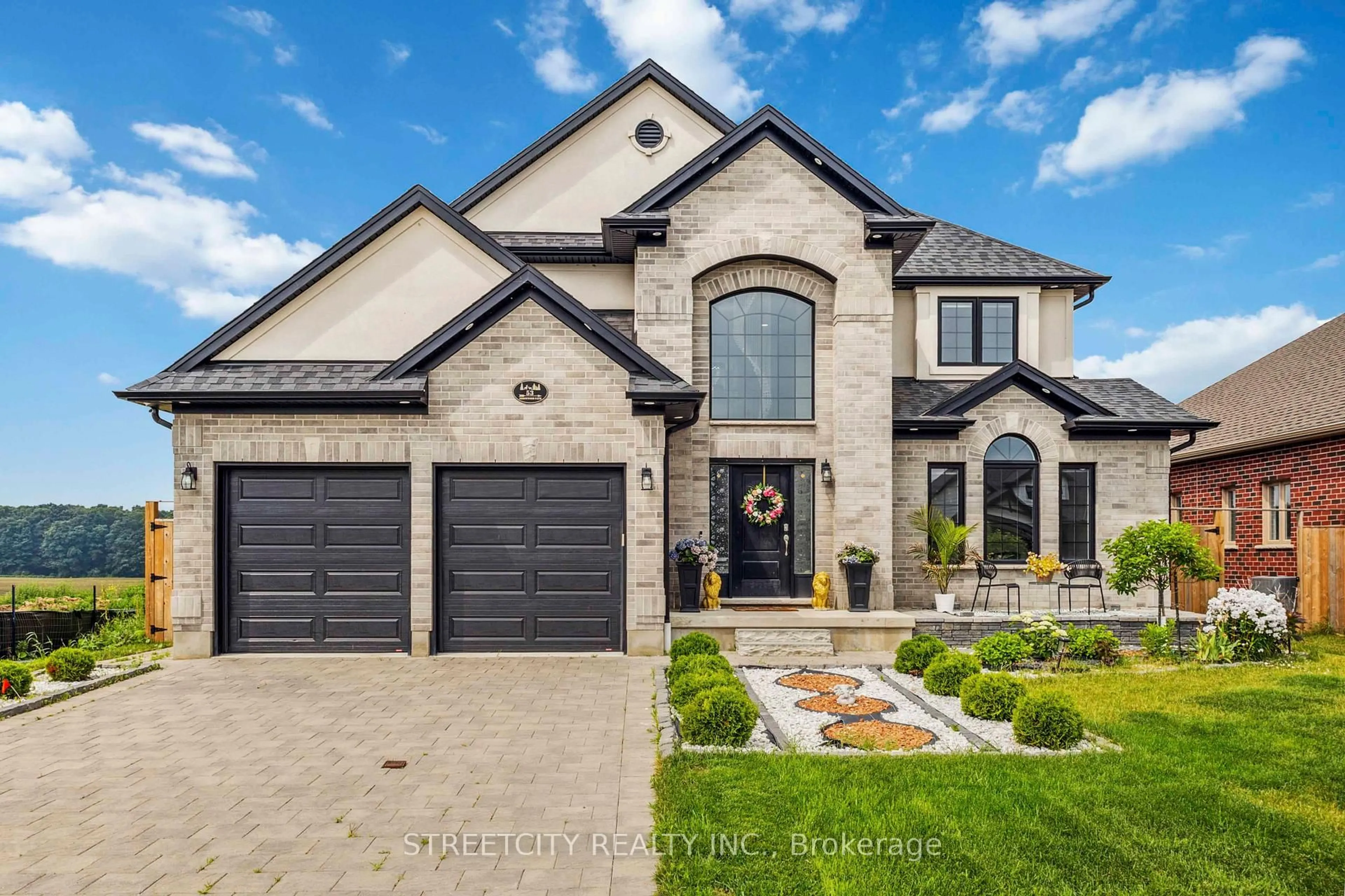 Home with brick exterior material, street for 53 Arrowwood Path, Middlesex Centre Ontario N0M 2A0