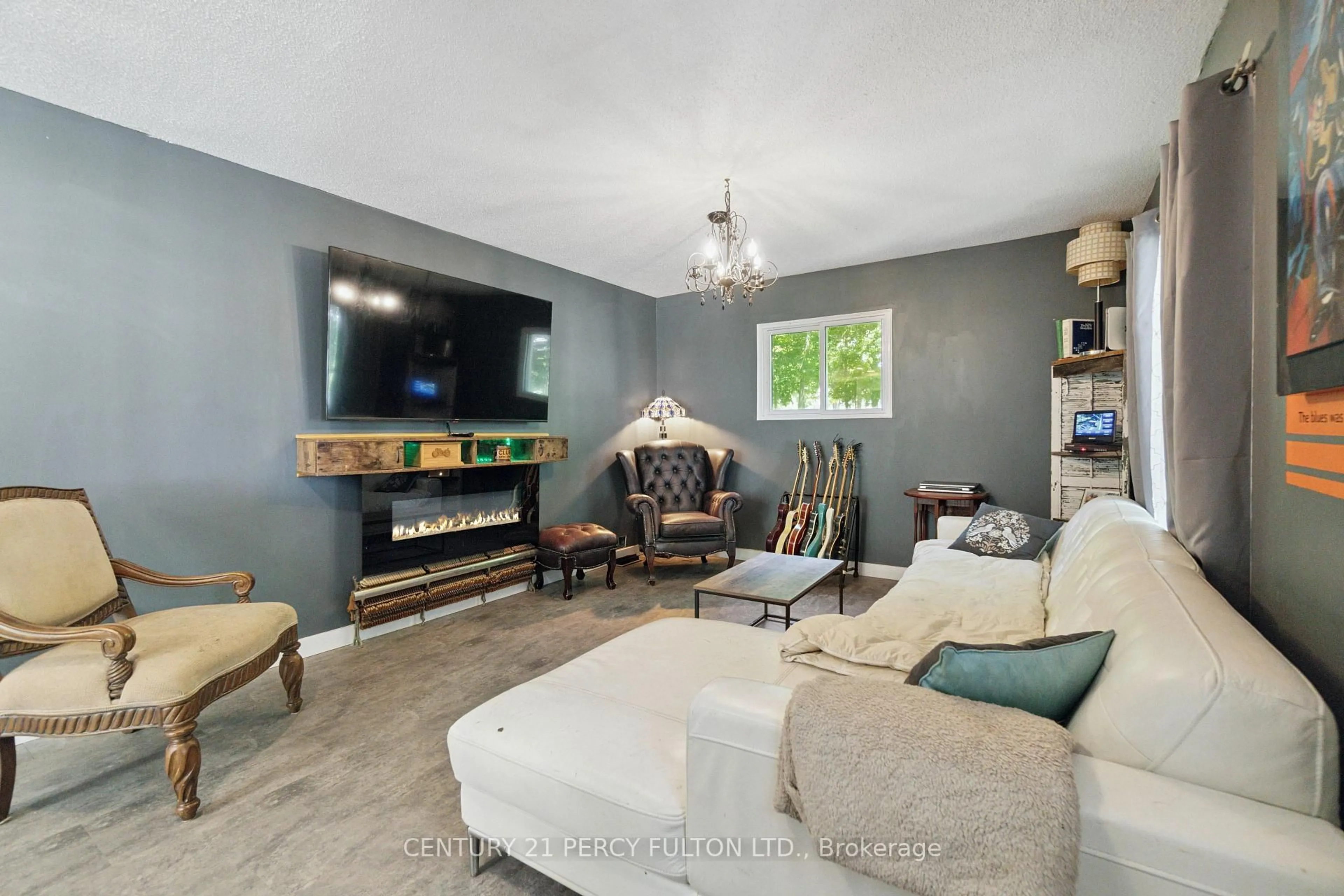 Living room with furniture, wood/laminate floor for 3752 Scotch Line Rd, Perth Ontario K7H 3C5