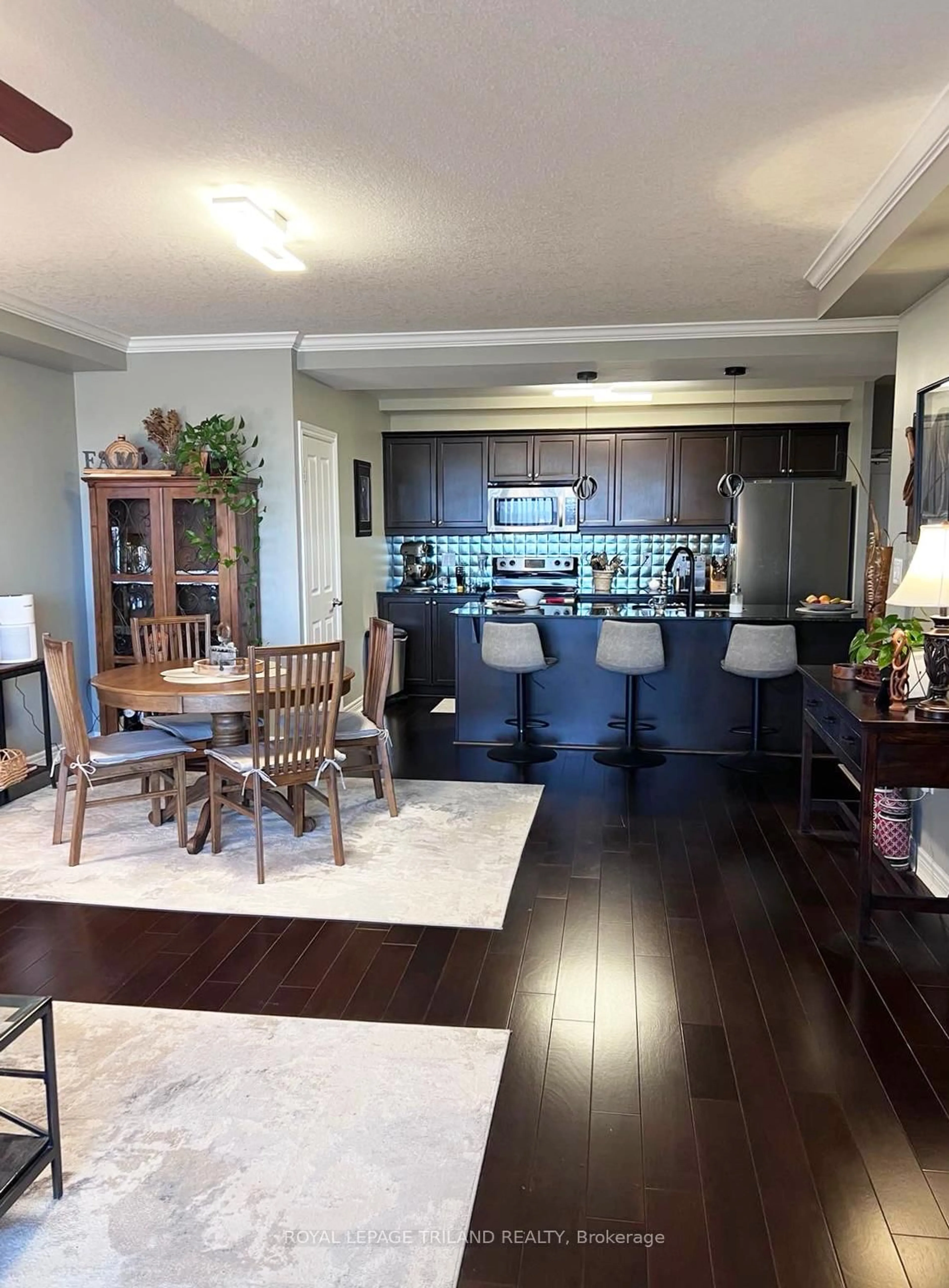 Open concept kitchen, wood/laminate floor for 1030 CORONATION Dr #909, London North Ontario N6G 0G5