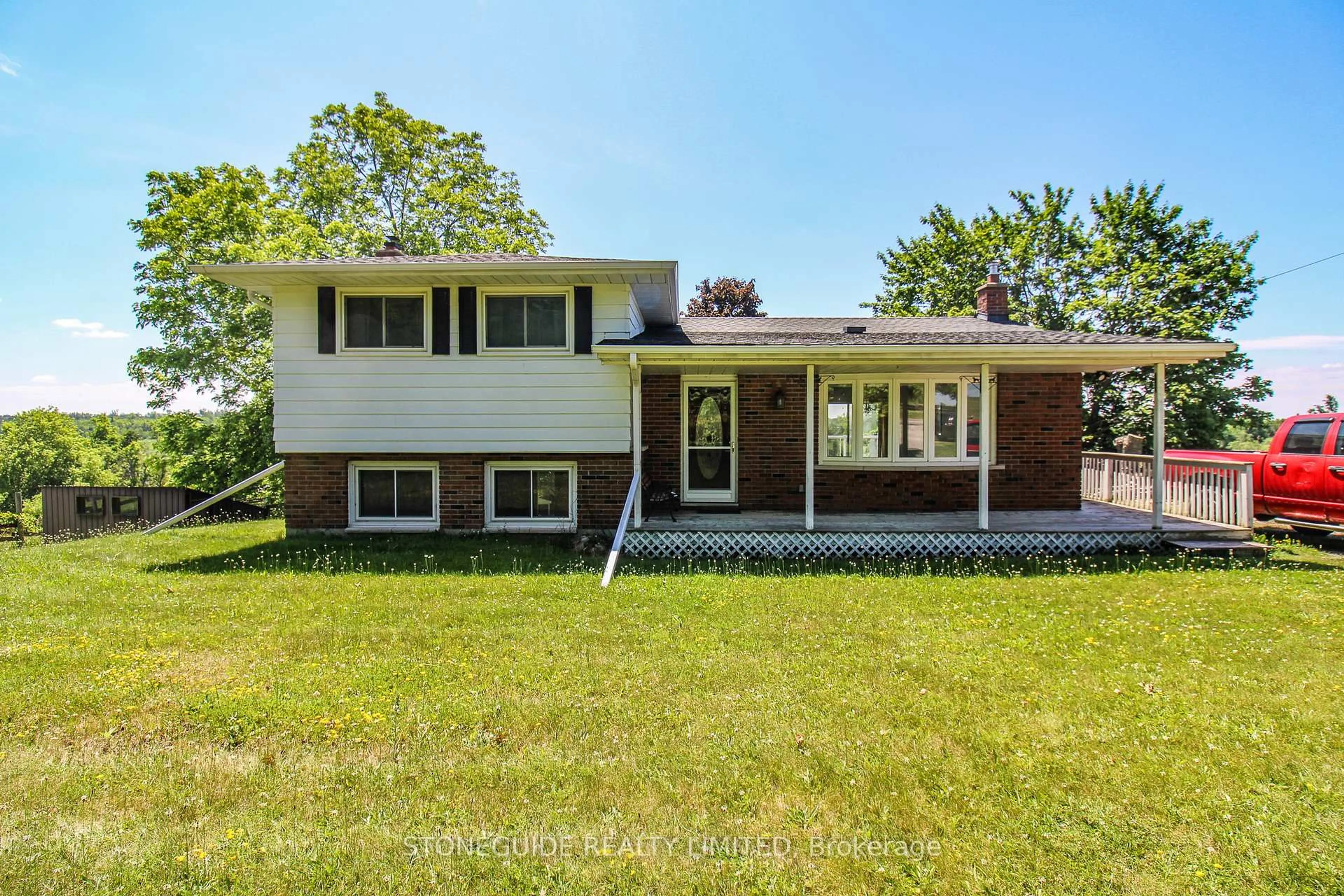 Home with vinyl exterior material, street for 527 Lily Lake Rd, Selwyn Ontario K9J 6X3