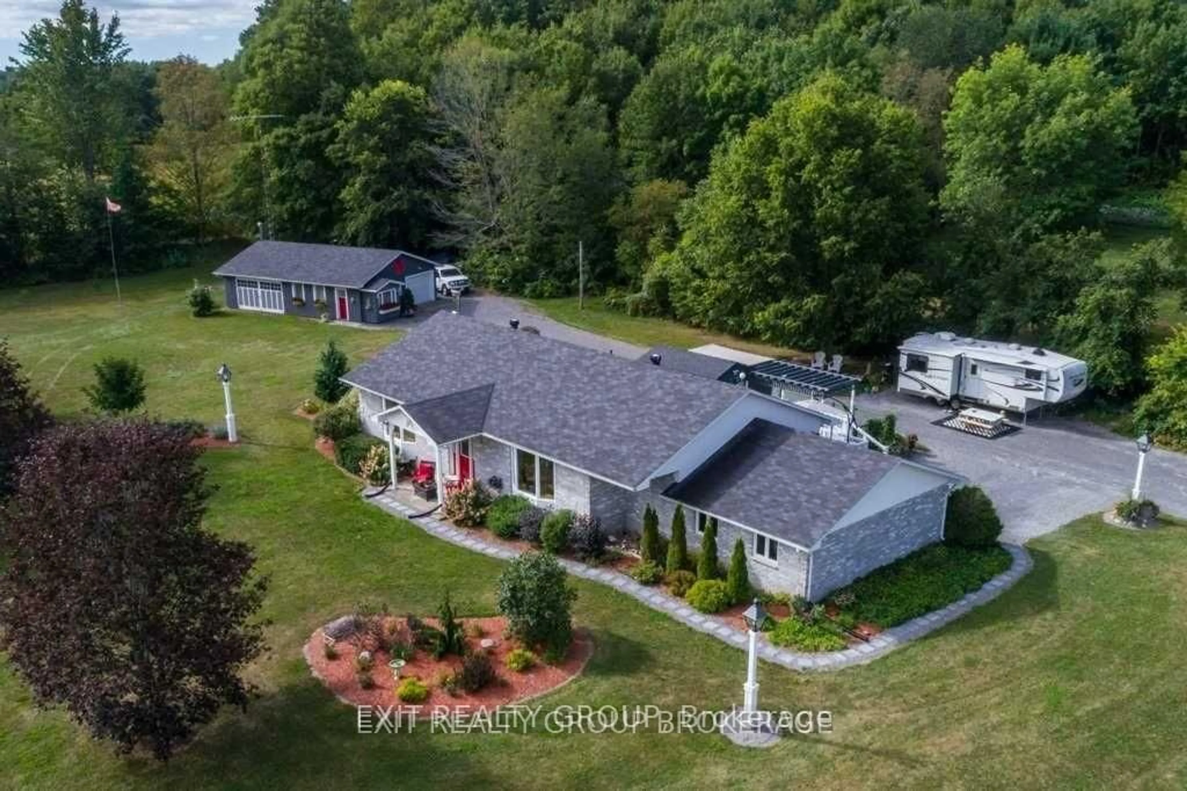 A pic from outside/outdoor area/front of a property/back of a property/a pic from drone, mountain view for 23 Palmer Rd, Tweed Ontario K0K 3J0