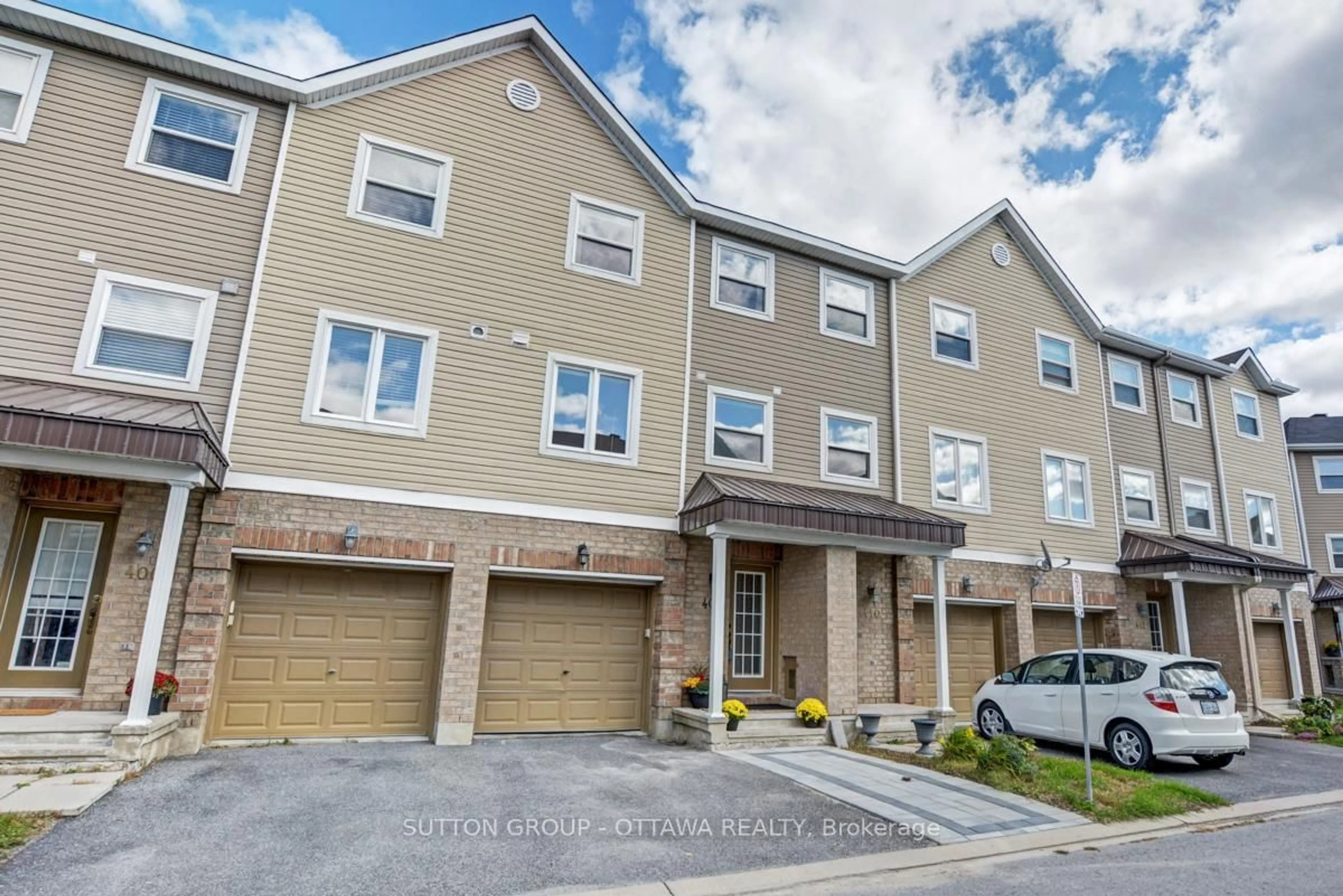 A pic from outside/outdoor area/front of a property/back of a property/a pic from drone, street for 408 Sadar Private, Ottawa Ontario K2J 3T3