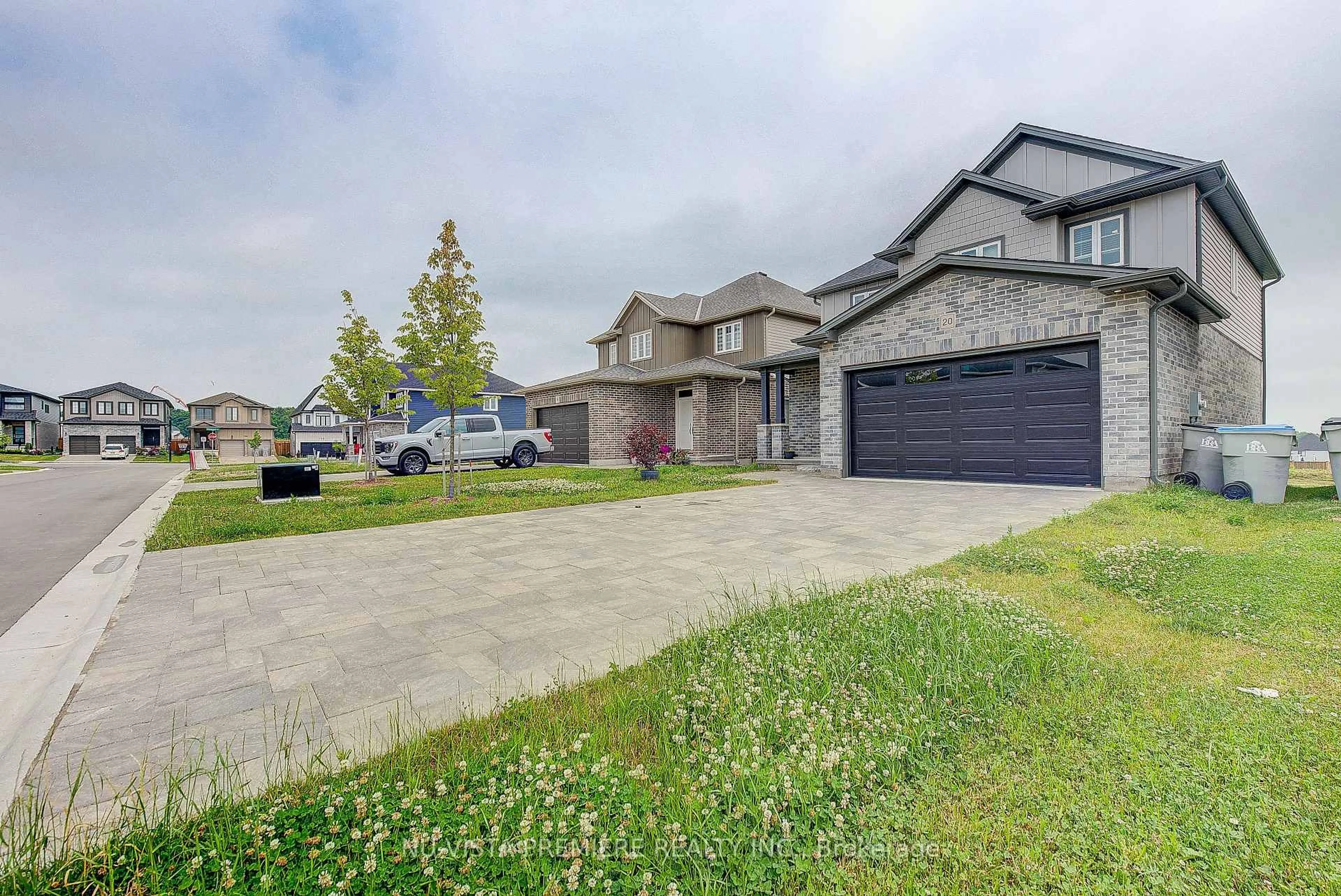 A pic from outside/outdoor area/front of a property/back of a property/a pic from drone, street for 20 Basil Cres, Middlesex Centre Ontario N0M 2A0