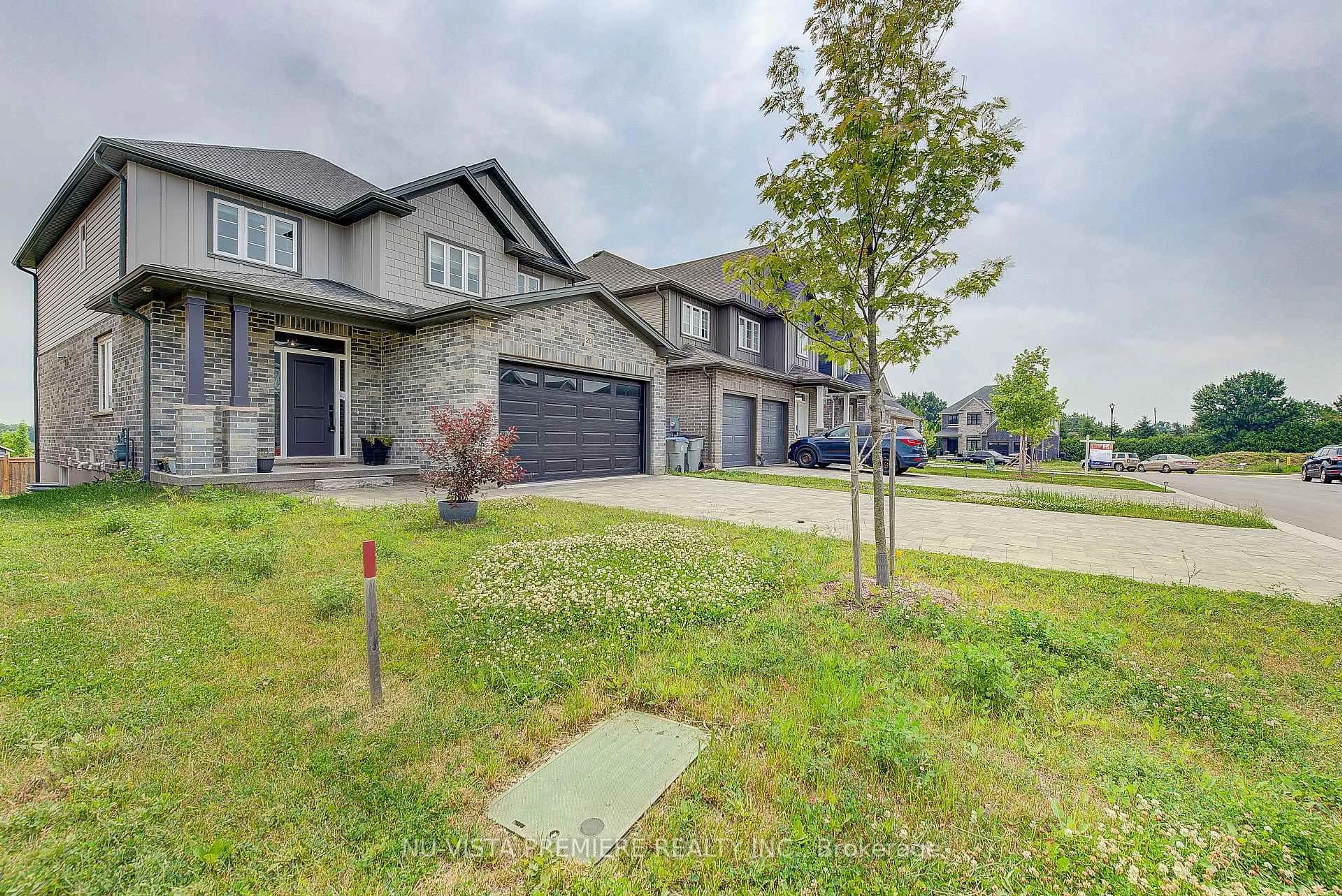 A pic from outside/outdoor area/front of a property/back of a property/a pic from drone, street for 20 Basil Cres, Middlesex Centre Ontario N0M 2A0