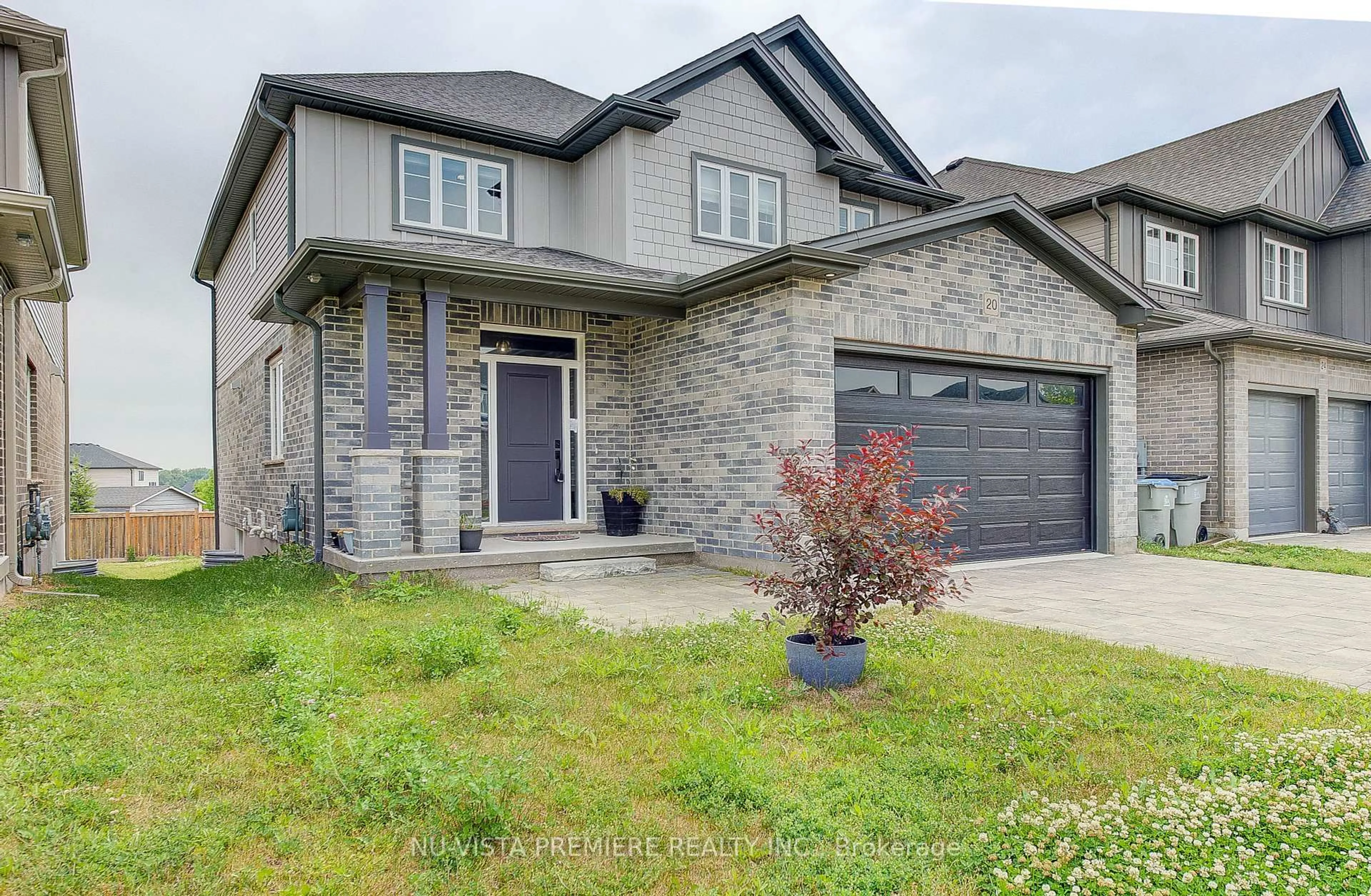 Home with brick exterior material, street for 20 Basil Cres, Middlesex Centre Ontario N0M 2A0