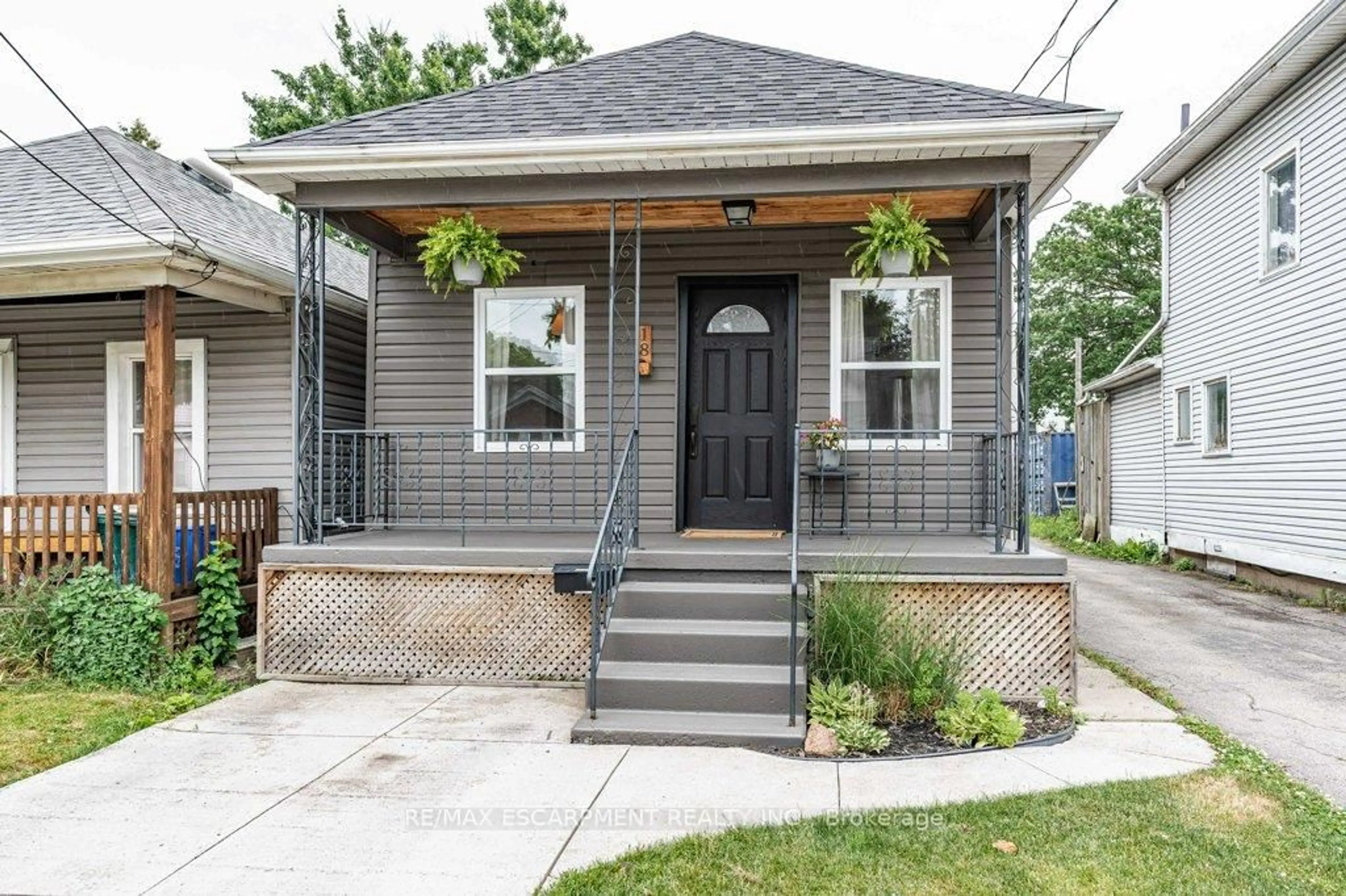 Home with brick exterior material, street for 18 ELLIS Ave, Hamilton Ontario L8H 4L7