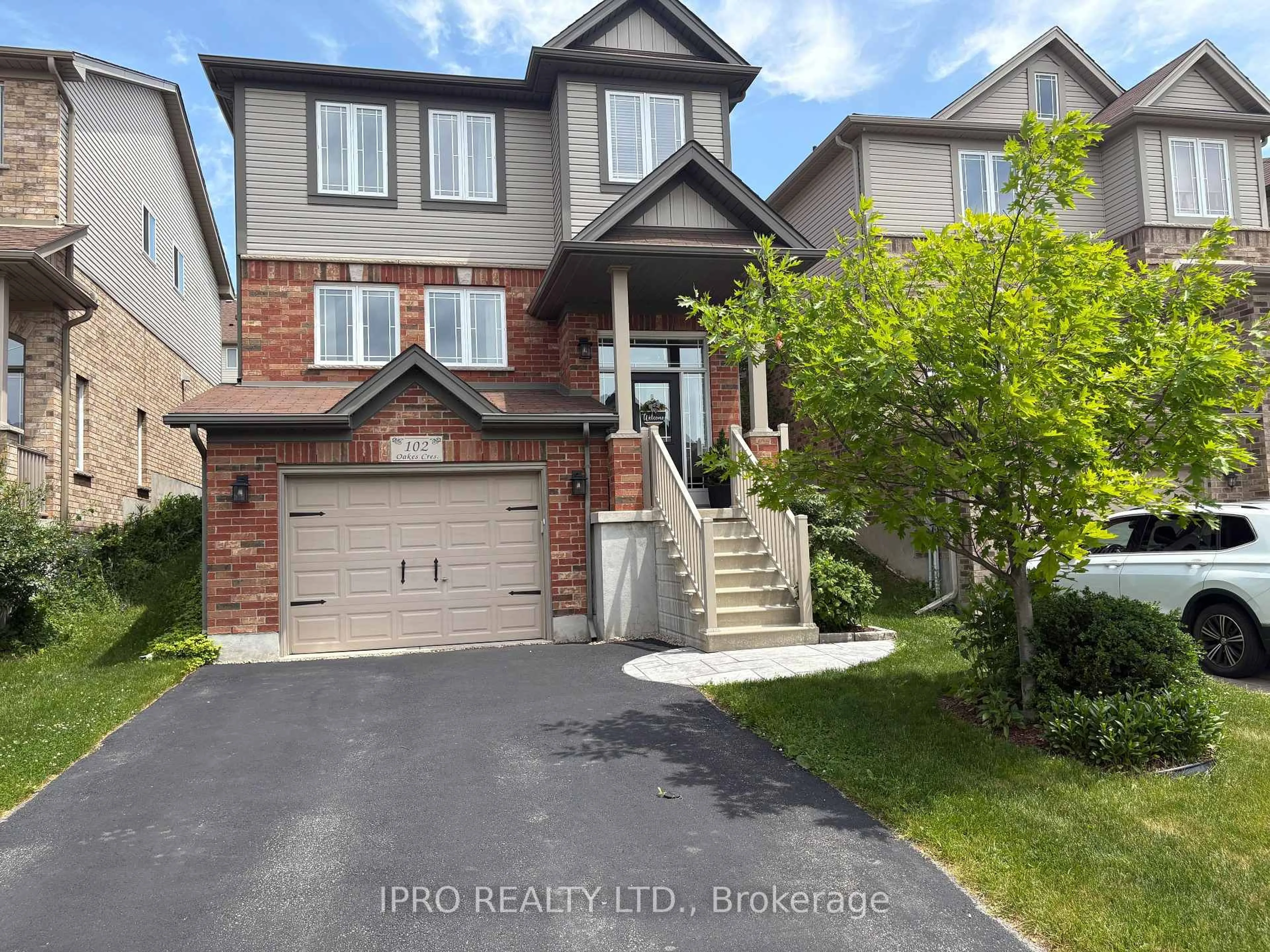 Home with brick exterior material, street for 102 Oakes Cres, Guelph Ontario N1E 0J5