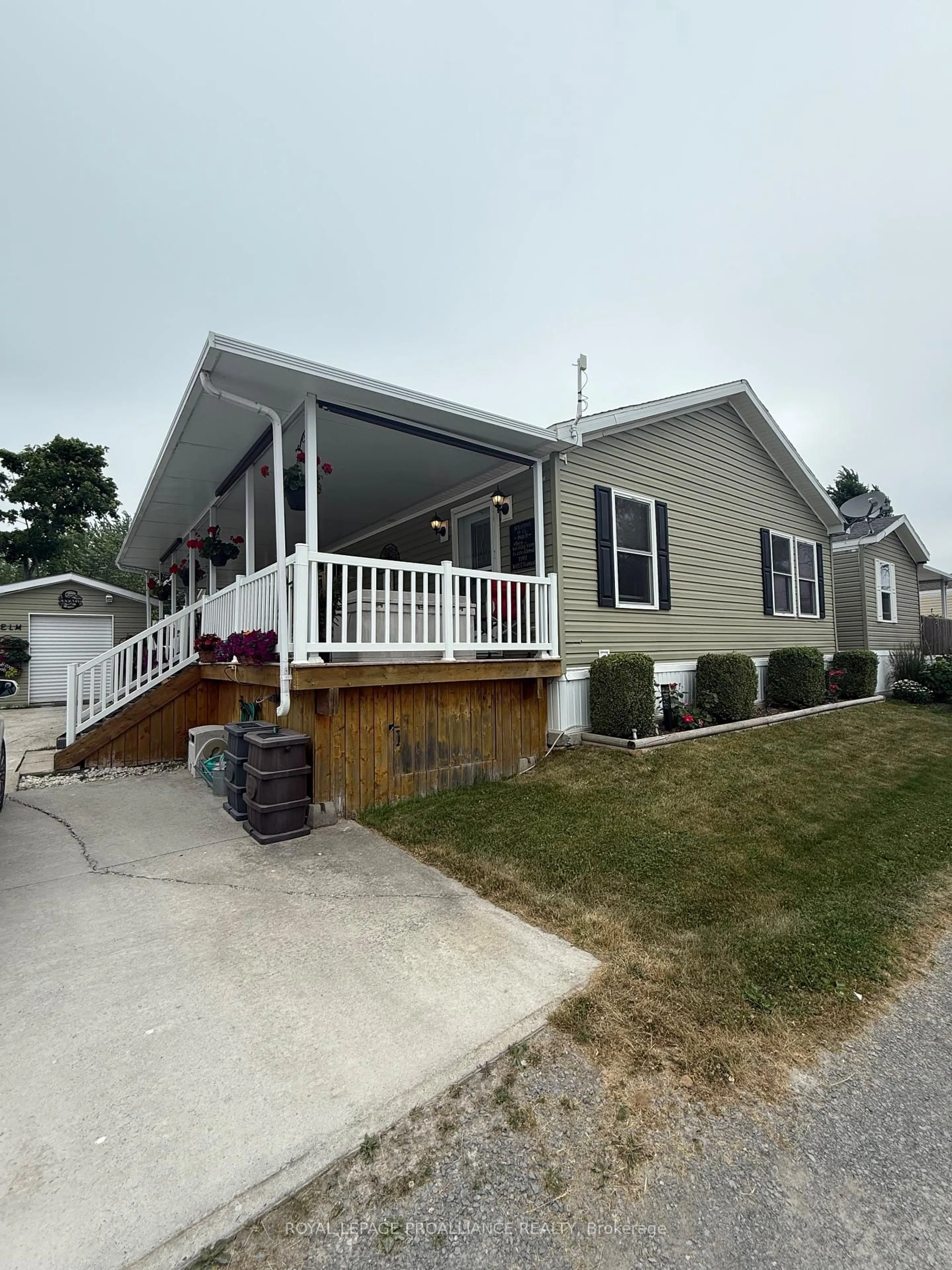 Home with vinyl exterior material, street for 153 County Road 27 #Unit 96, Prince Edward County Ontario K0K 1T0