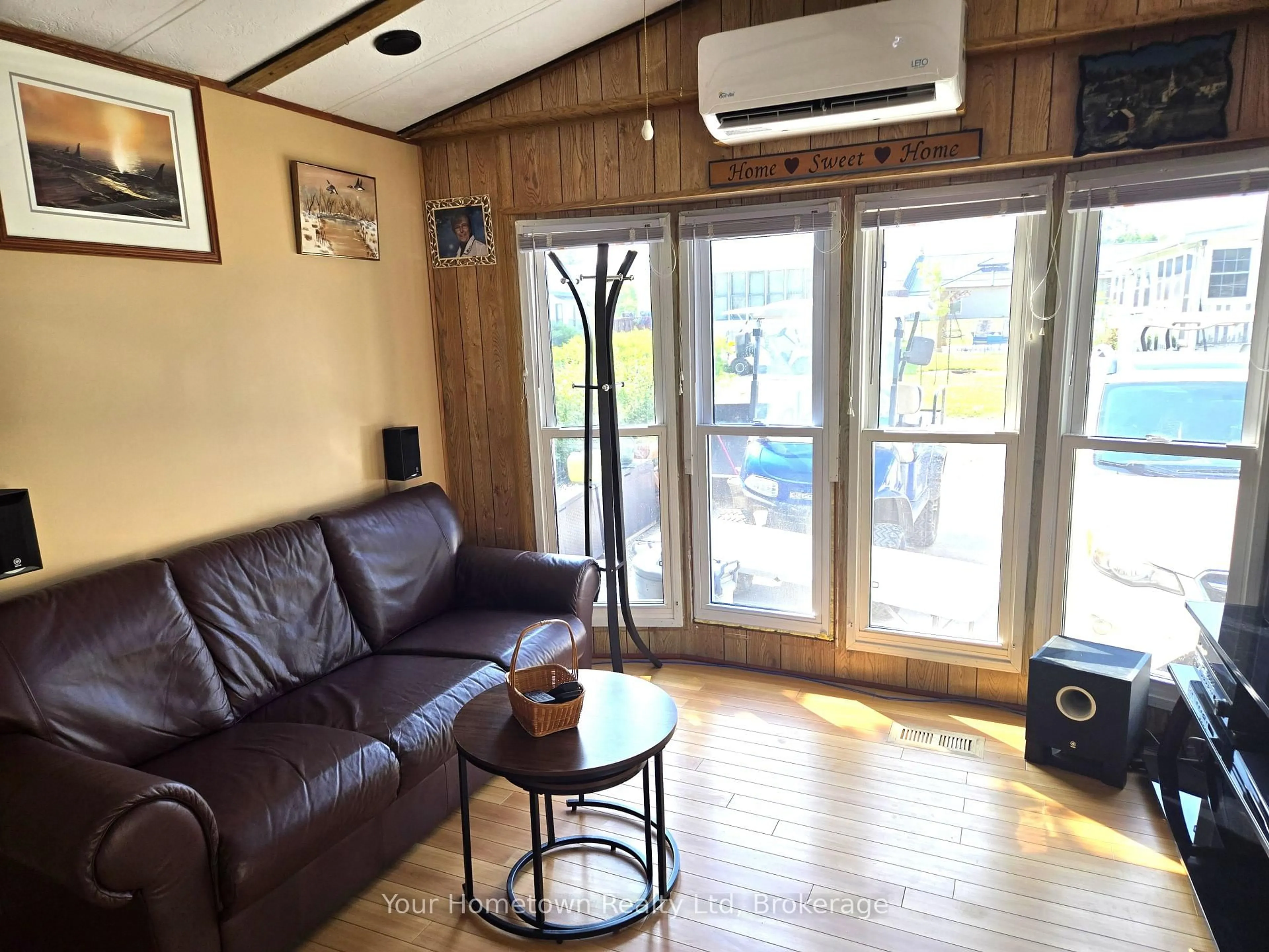 Living room with furniture, wood/laminate floor for 196 Beach Rd, Centre Wellington Ontario N1M 2W5