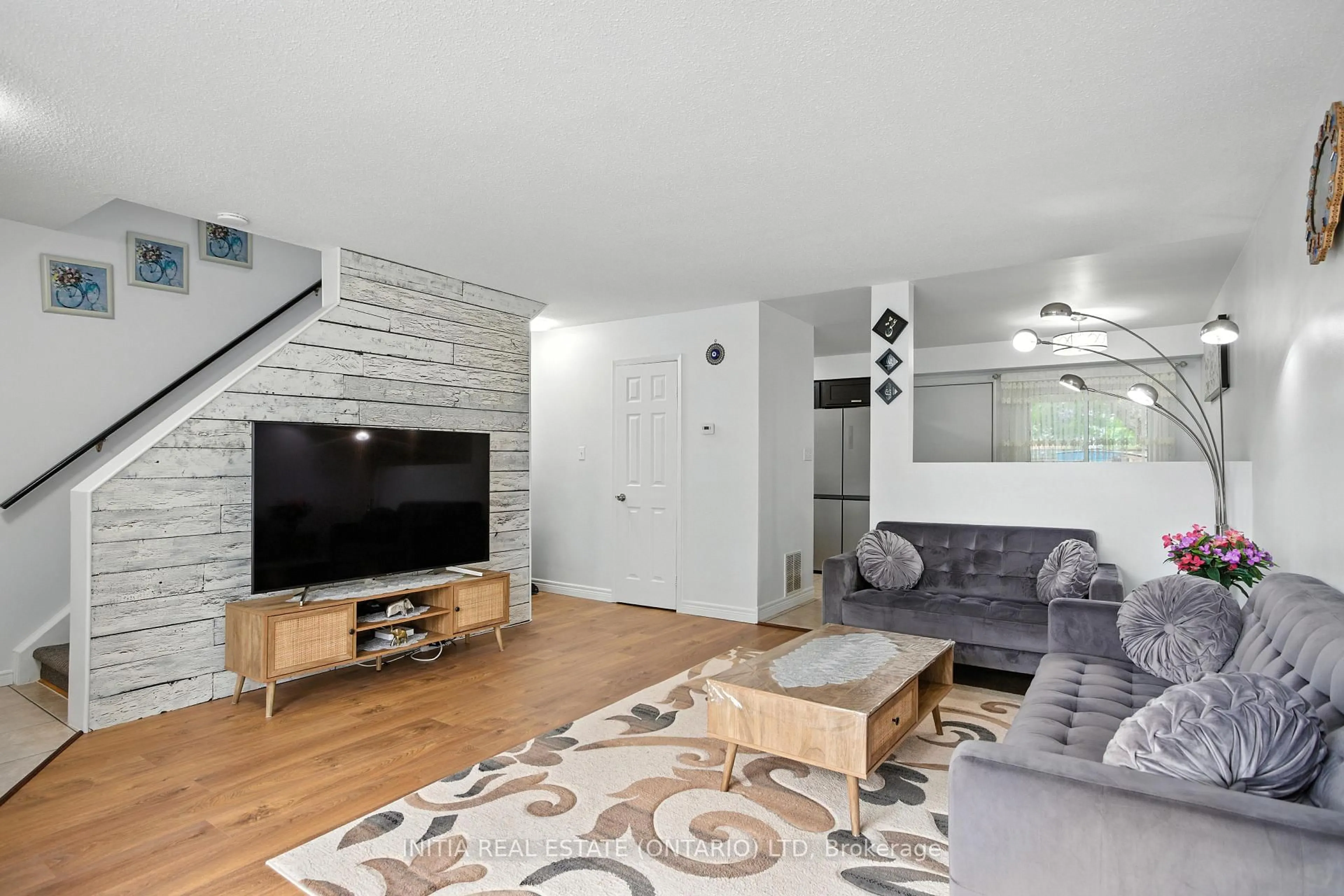 Living room with furniture, wood/laminate floor for 1725 Ernest Ave #58, London South Ontario N6E 2W3