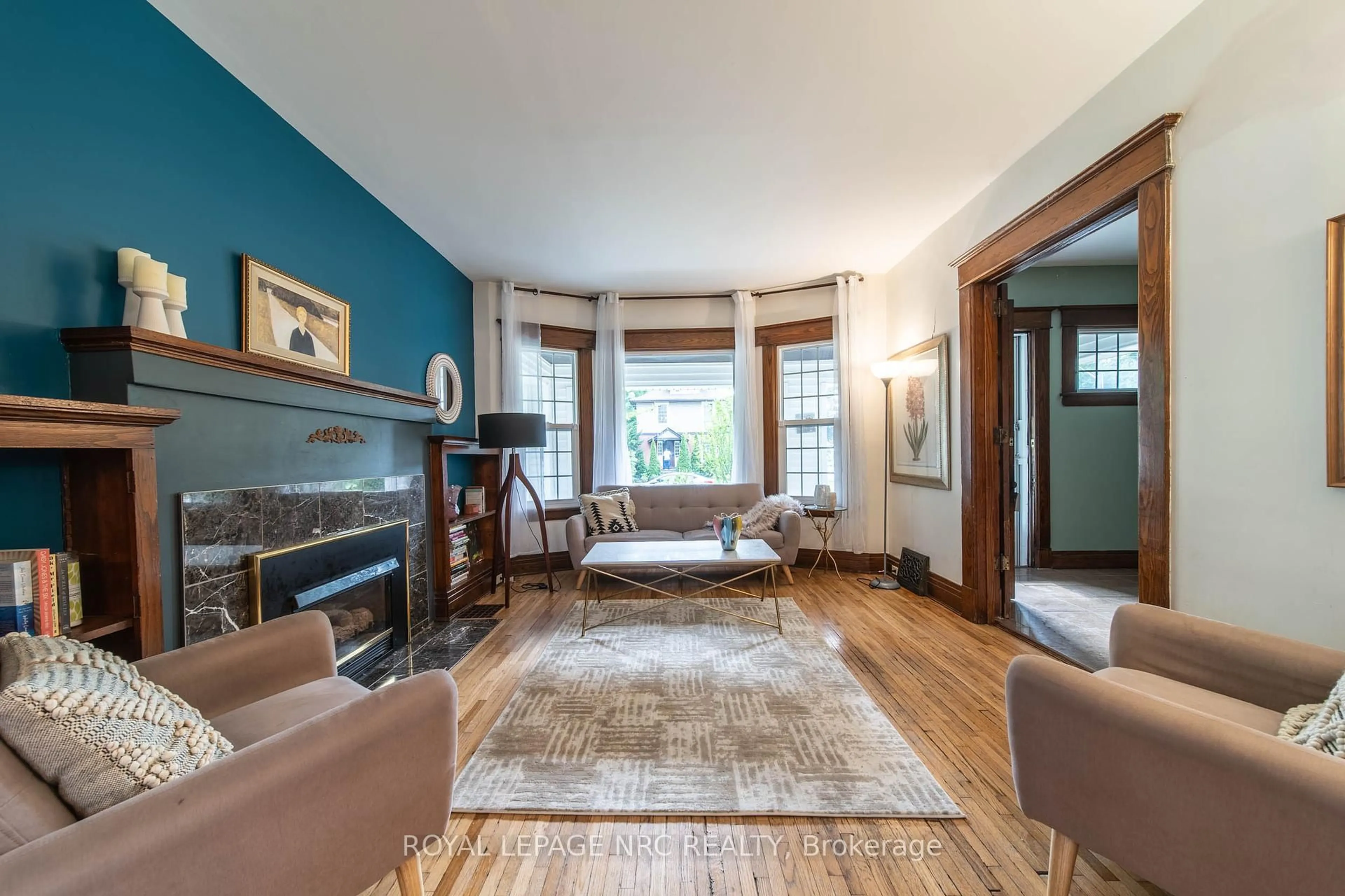 Living room with furniture, wood/laminate floor for 6274 Pine Grove Ave, Niagara Falls Ontario L2G 4J3