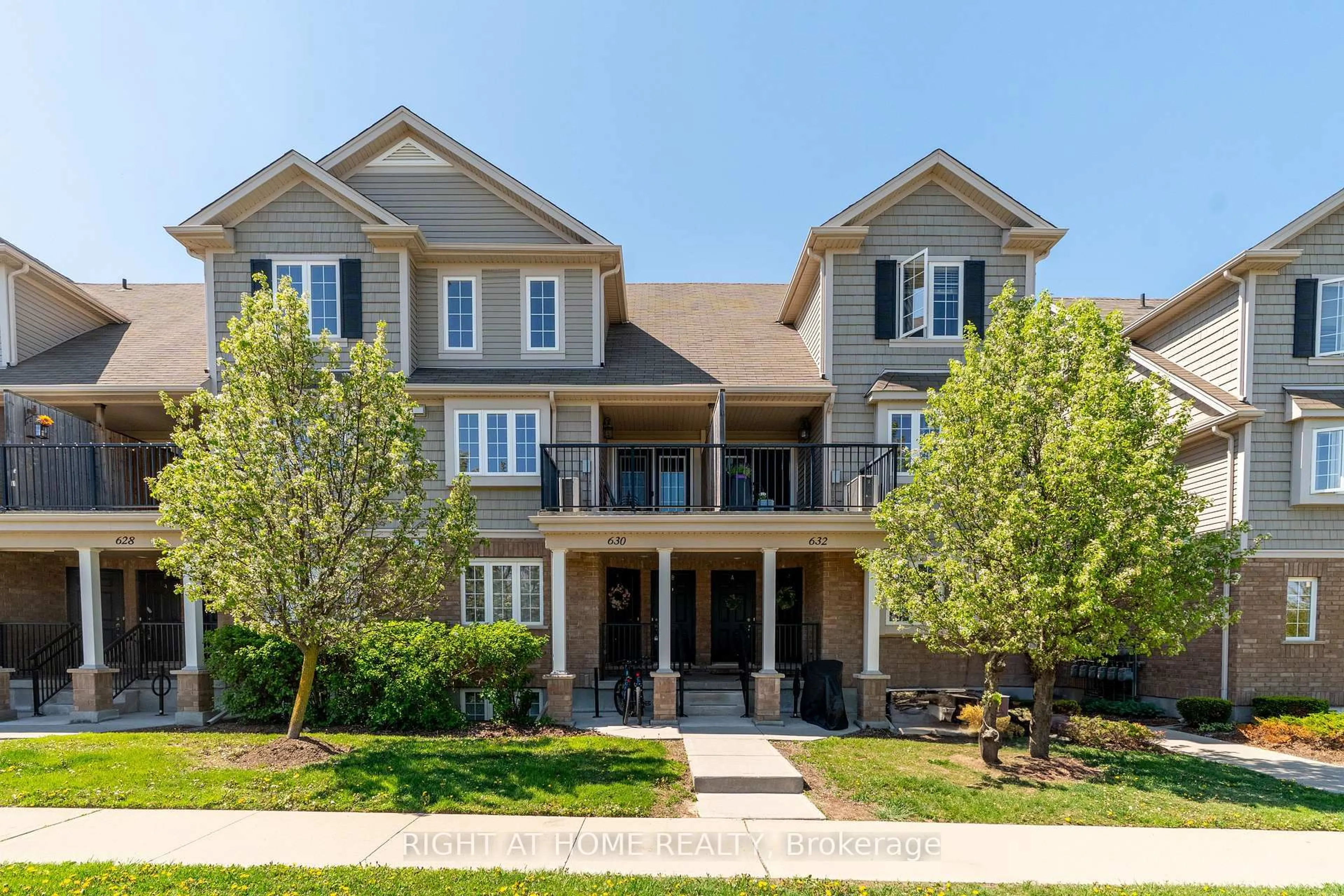 Home with brick exterior material, street for 630 Woodlawn Rd #B, Guelph Ontario N1E 0K4