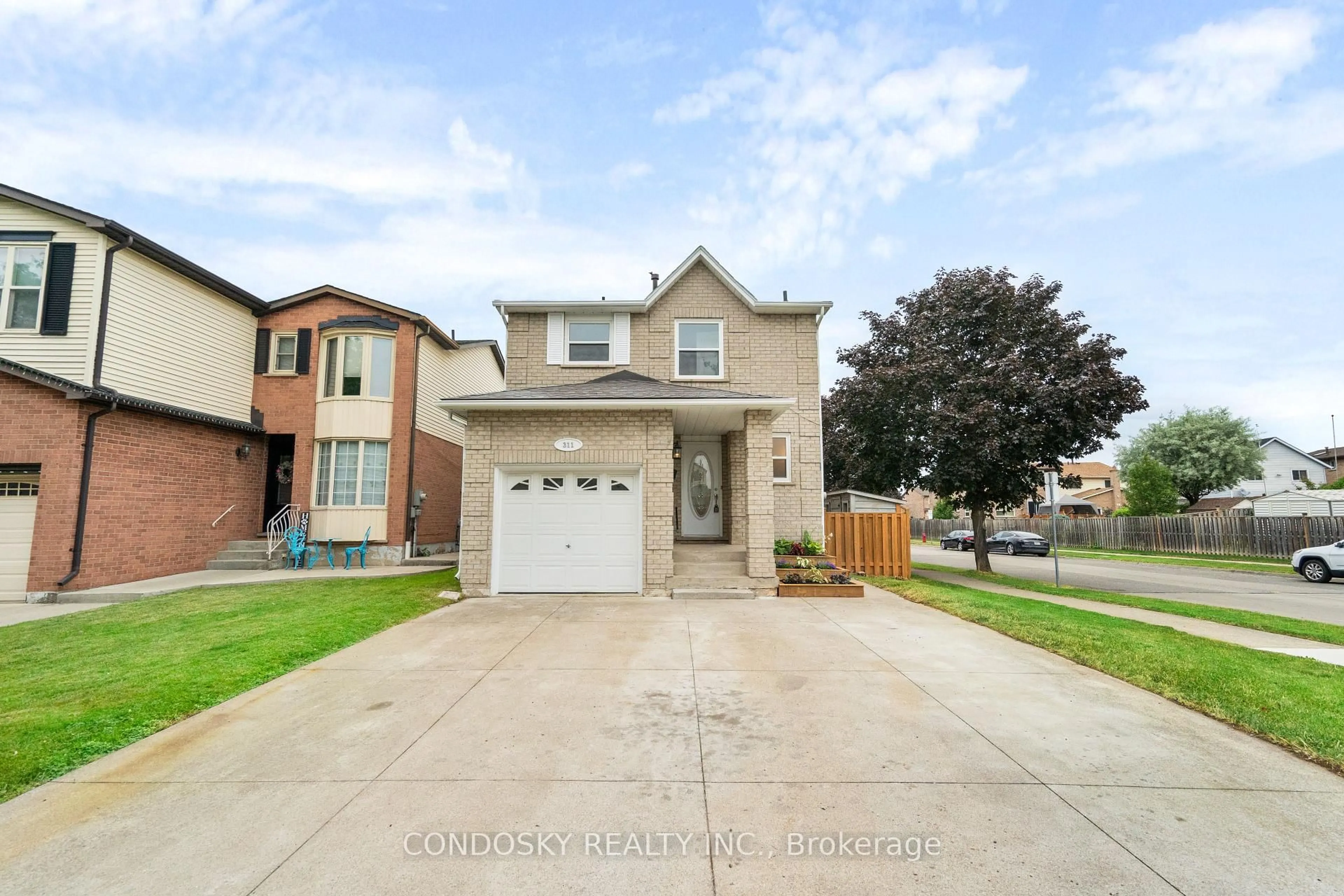 Home with brick exterior material, street for 311 Macintosh Dr, Hamilton Ontario L8E 3Z6