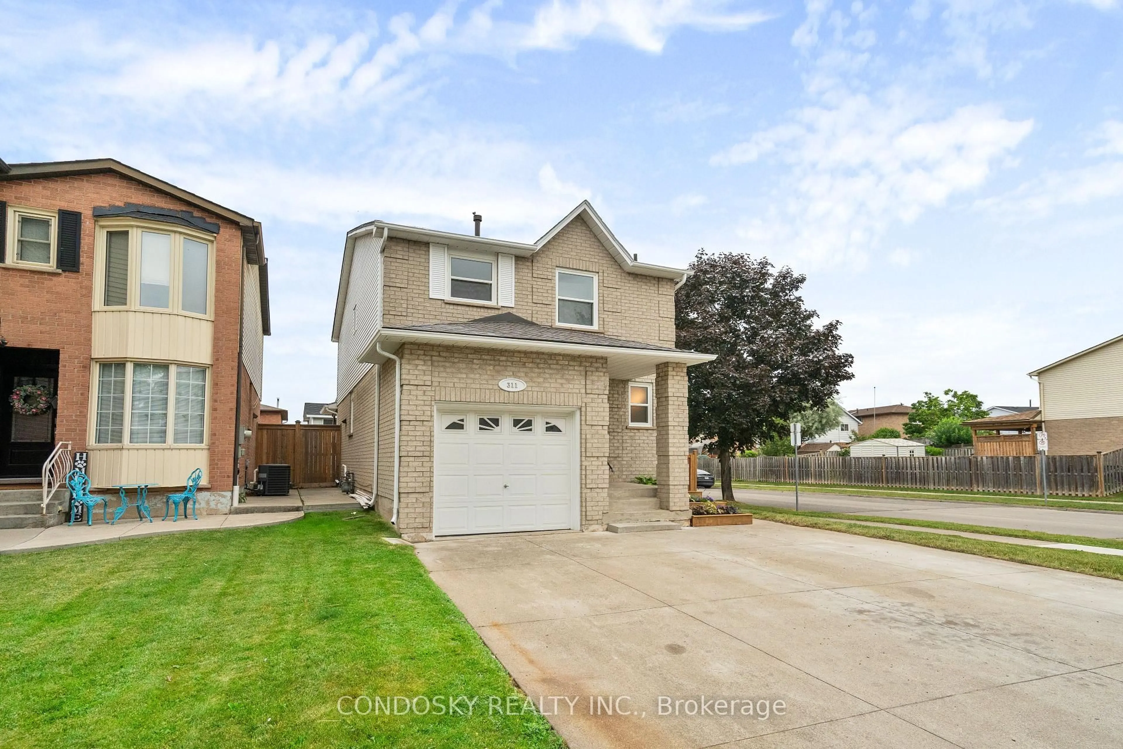 Home with brick exterior material, street for 311 Macintosh Dr, Hamilton Ontario L8E 3Z6