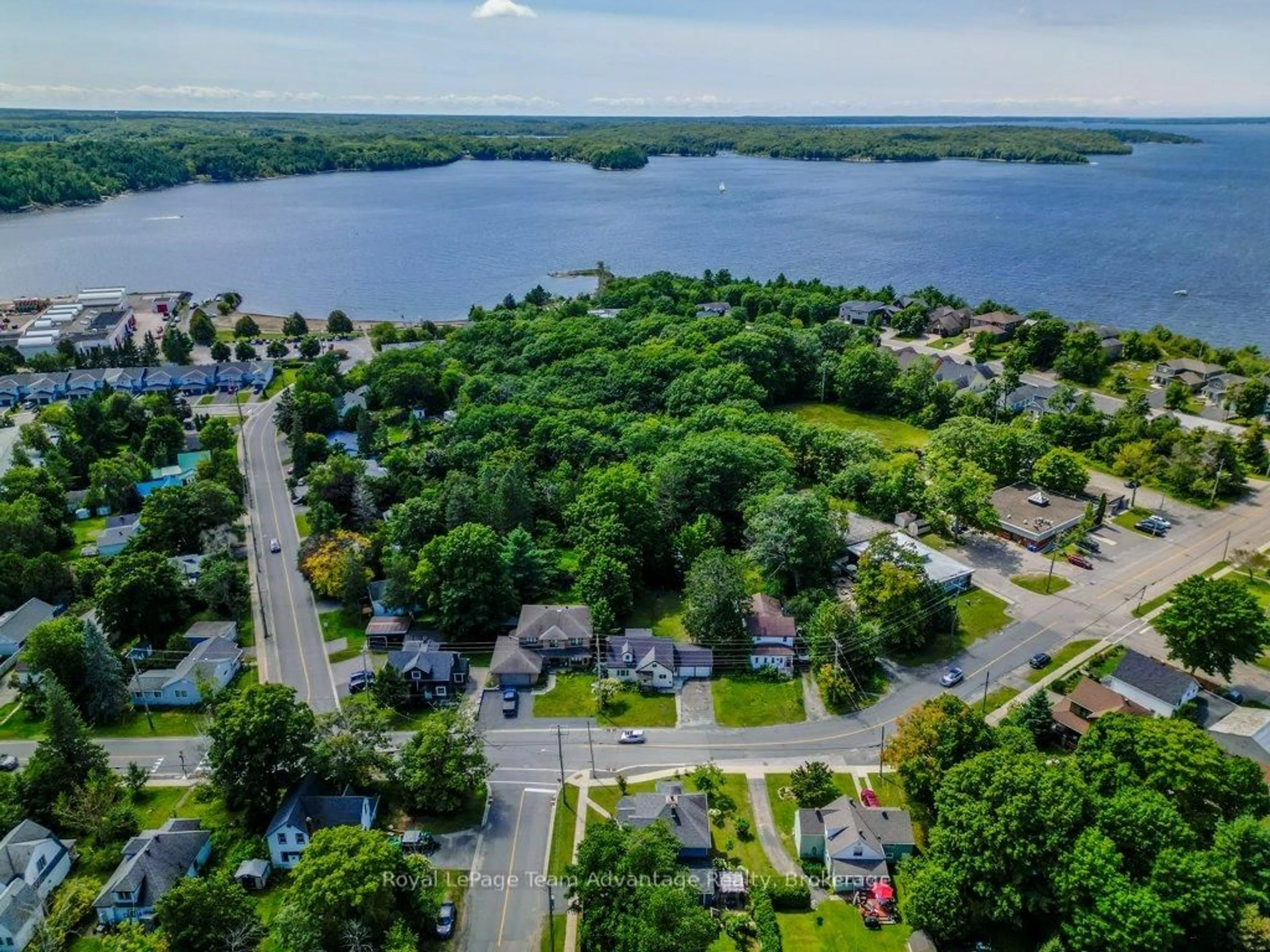A pic from outside/outdoor area/front of a property/back of a property/a pic from drone, water/lake/river/ocean view for 55 Waubeek St, Parry Sound Ontario P2A 1C4