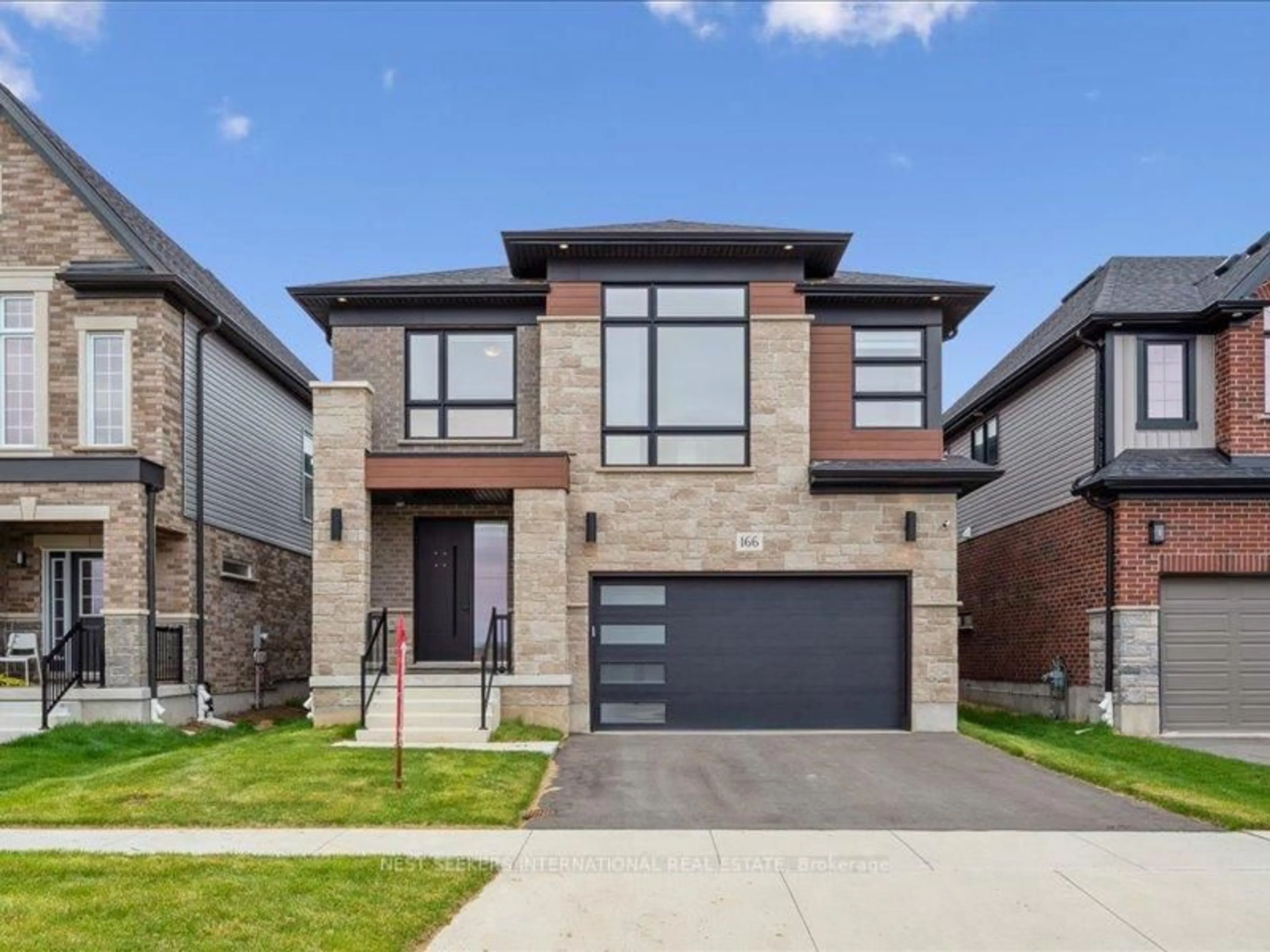 Home with brick exterior material, street for 166 Shaded Creek Dr, Kitchener Ontario N2P 0K7