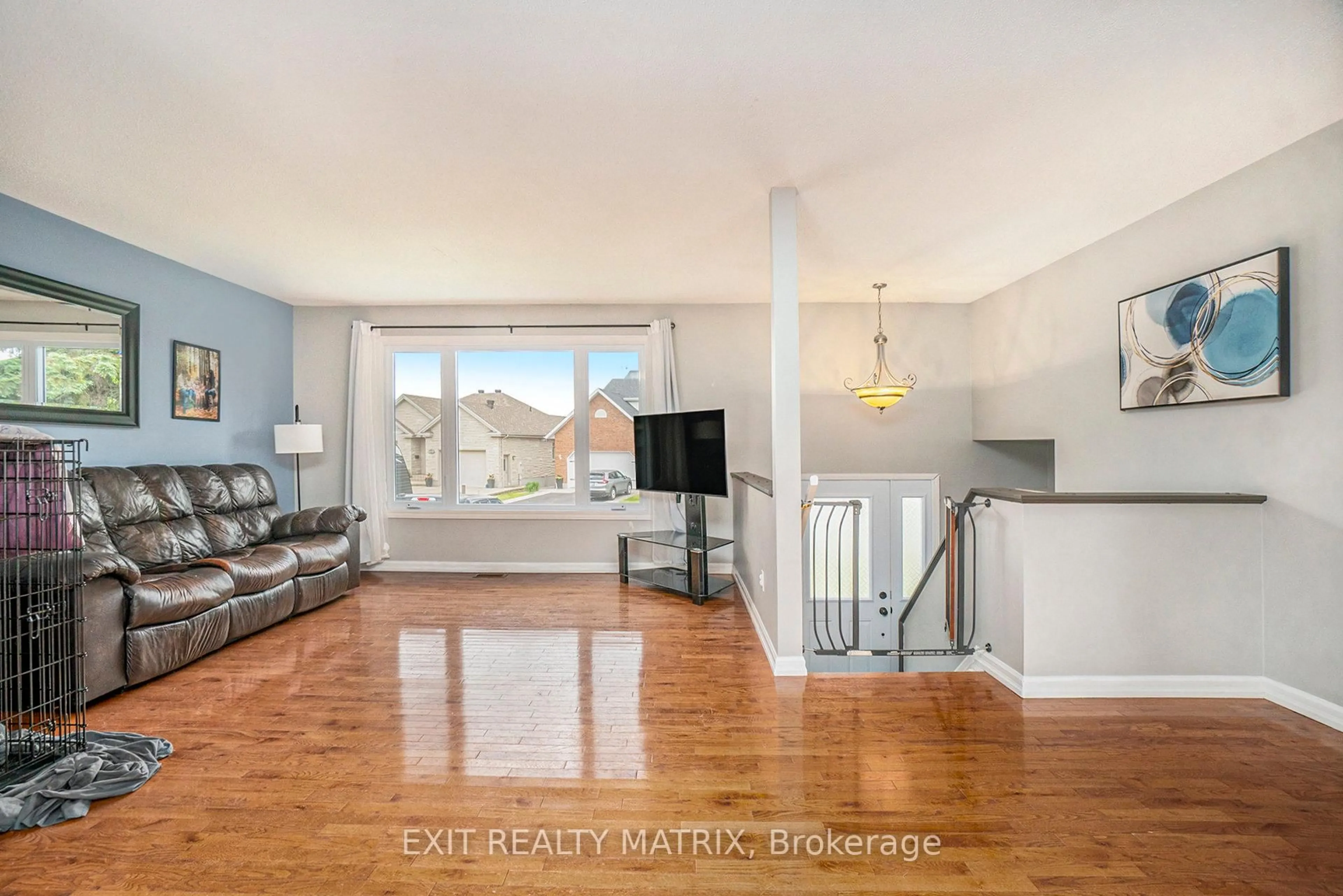 Living room with furniture, wood/laminate floor for 845 Laval St, Casselman Ontario K0A 1M0