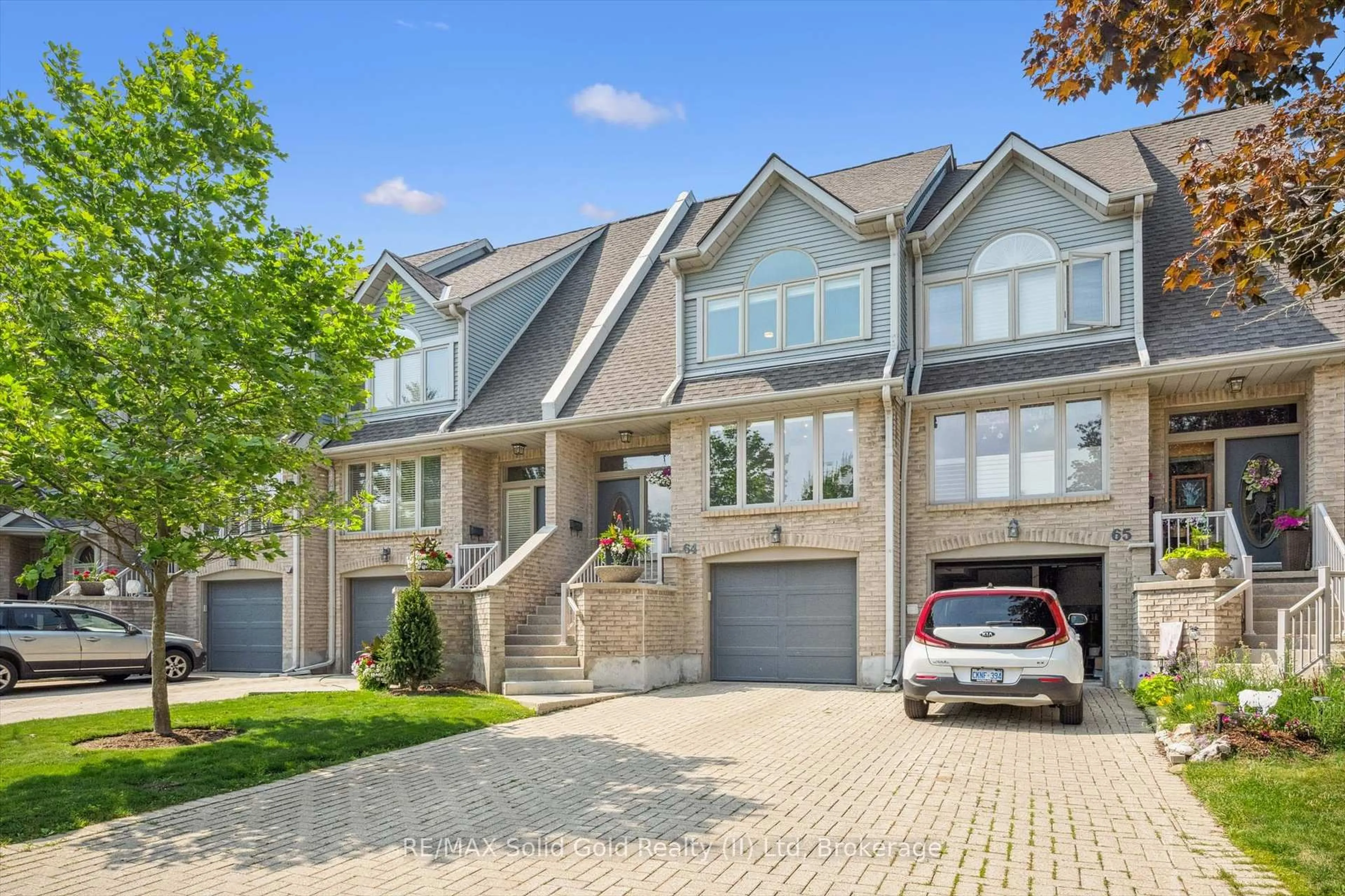 Home with brick exterior material, street for 225 Benjamin Rd #64, Waterloo Ontario N2V 1Z3