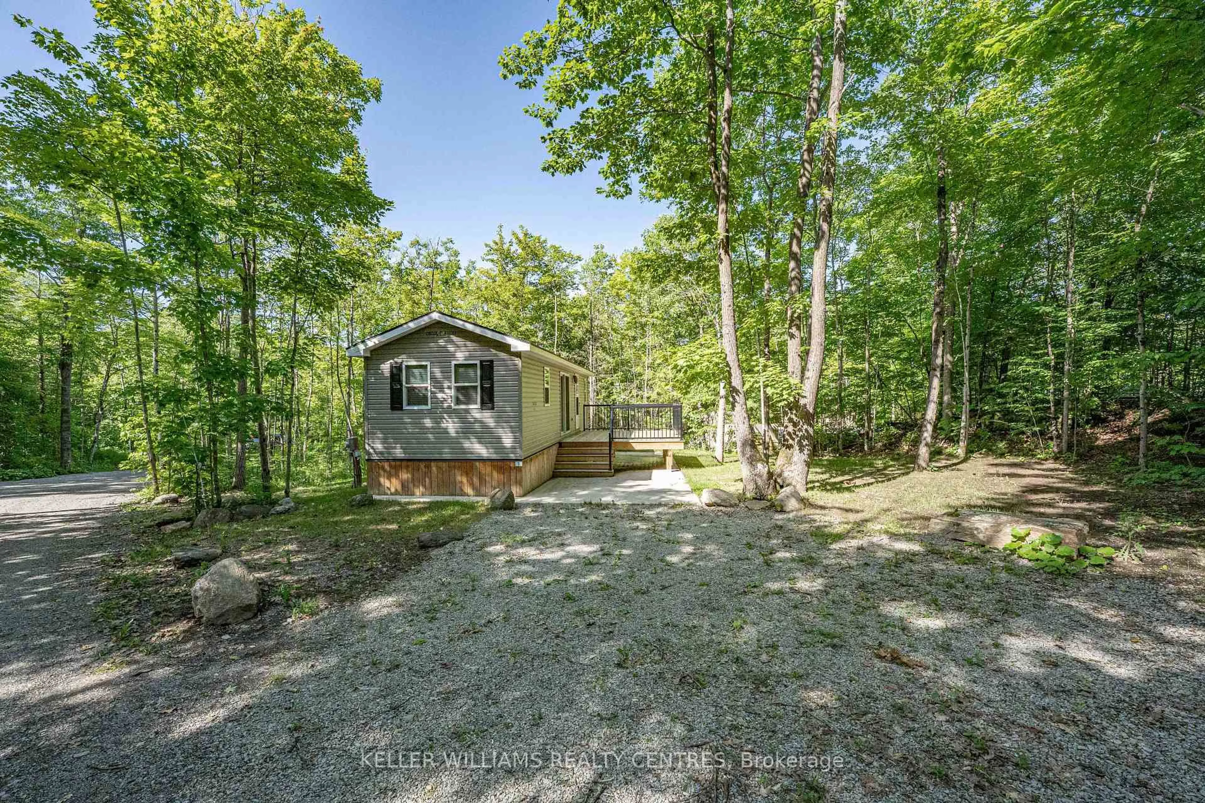A pic from outside/outdoor area/front of a property/back of a property/a pic from drone, forest/trees view for 202 HIDDEN GLEN Rd #Unit #4, Georgian Bay Ontario L0K 1S0