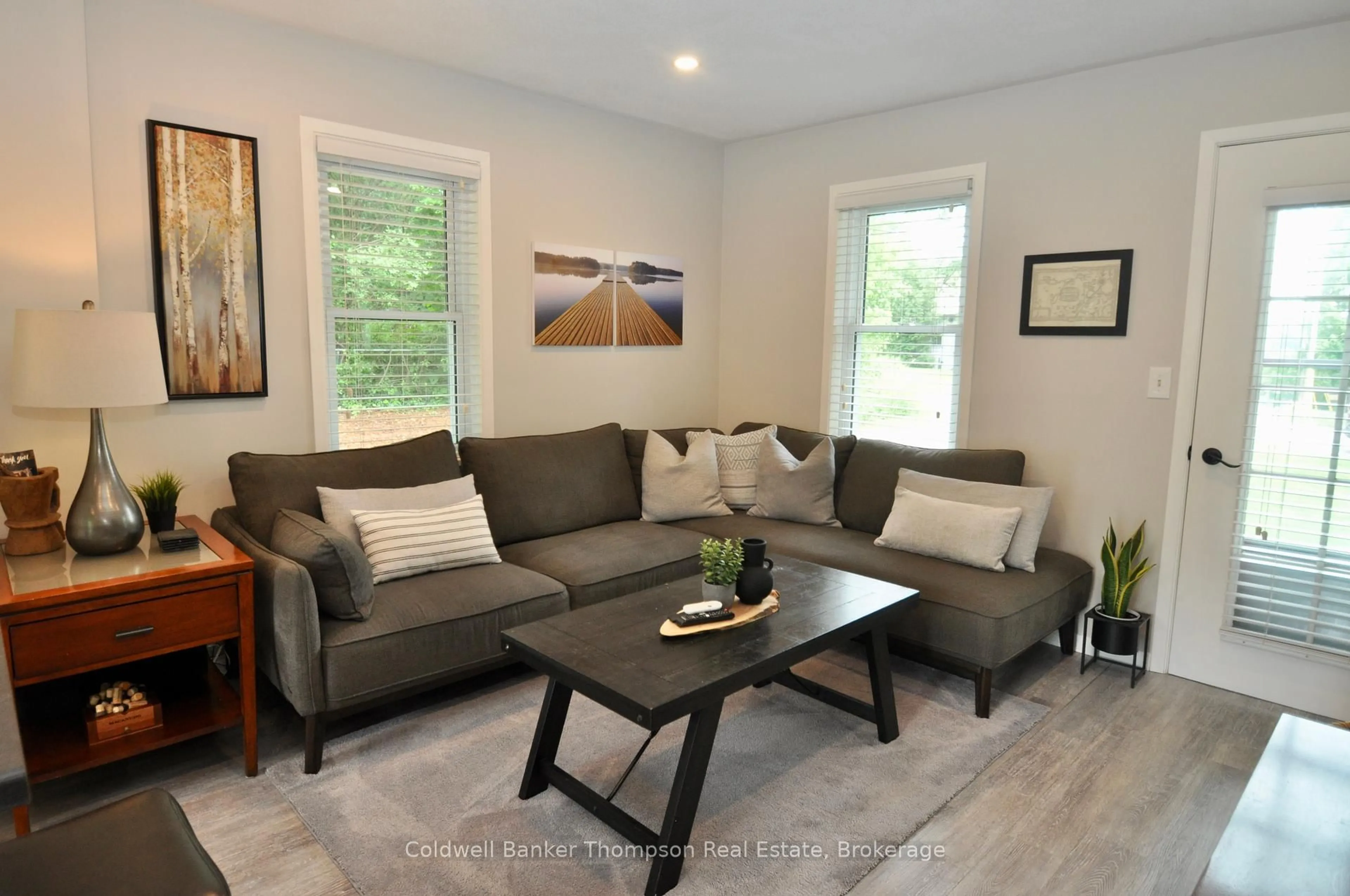 Living room with furniture, wood/laminate floor for 9 Maple Ave, Huntsville Ontario P1H 1H2