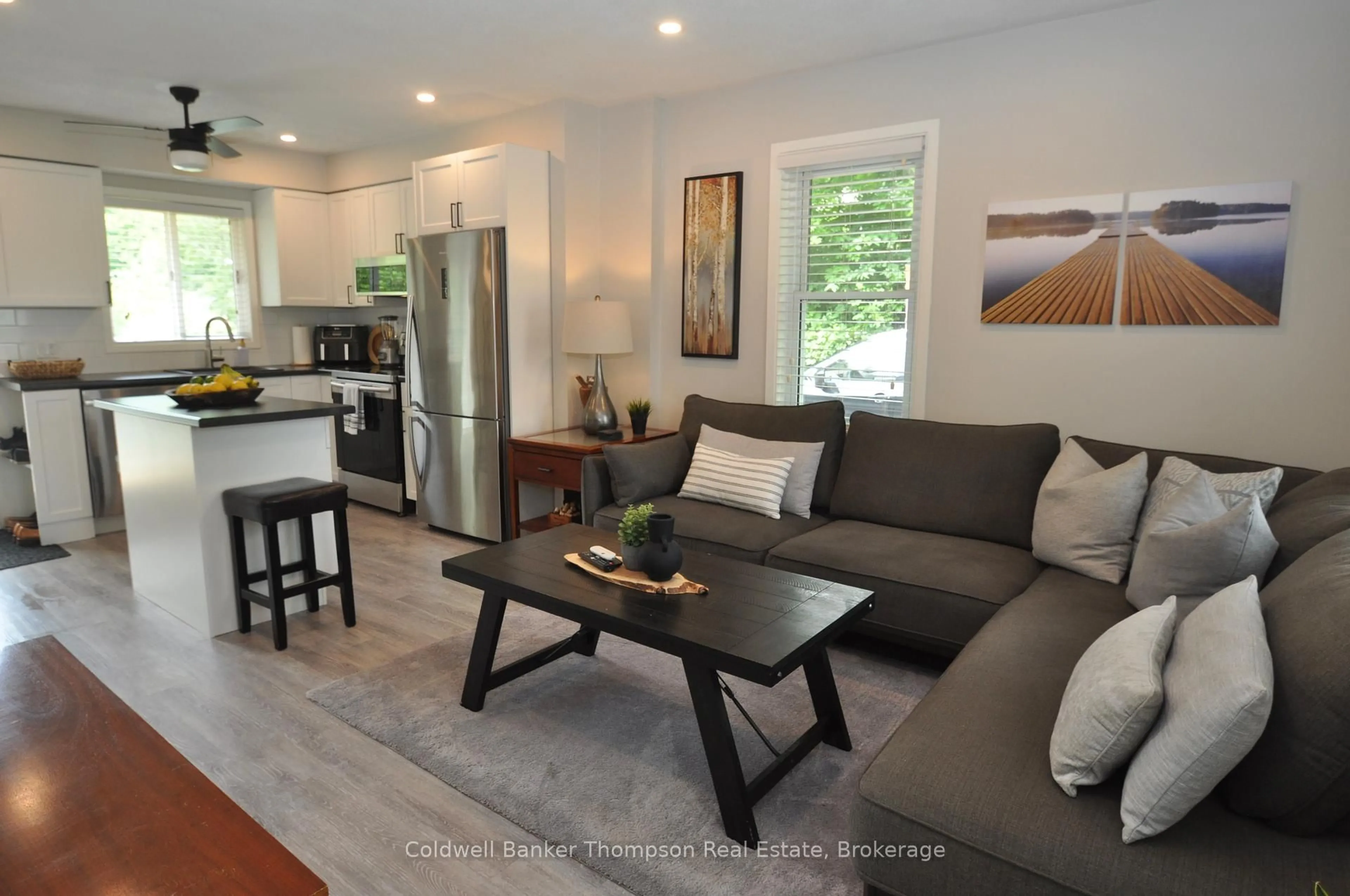 Living room with furniture, wood/laminate floor for 9 Maple Ave, Huntsville Ontario P1H 1H2