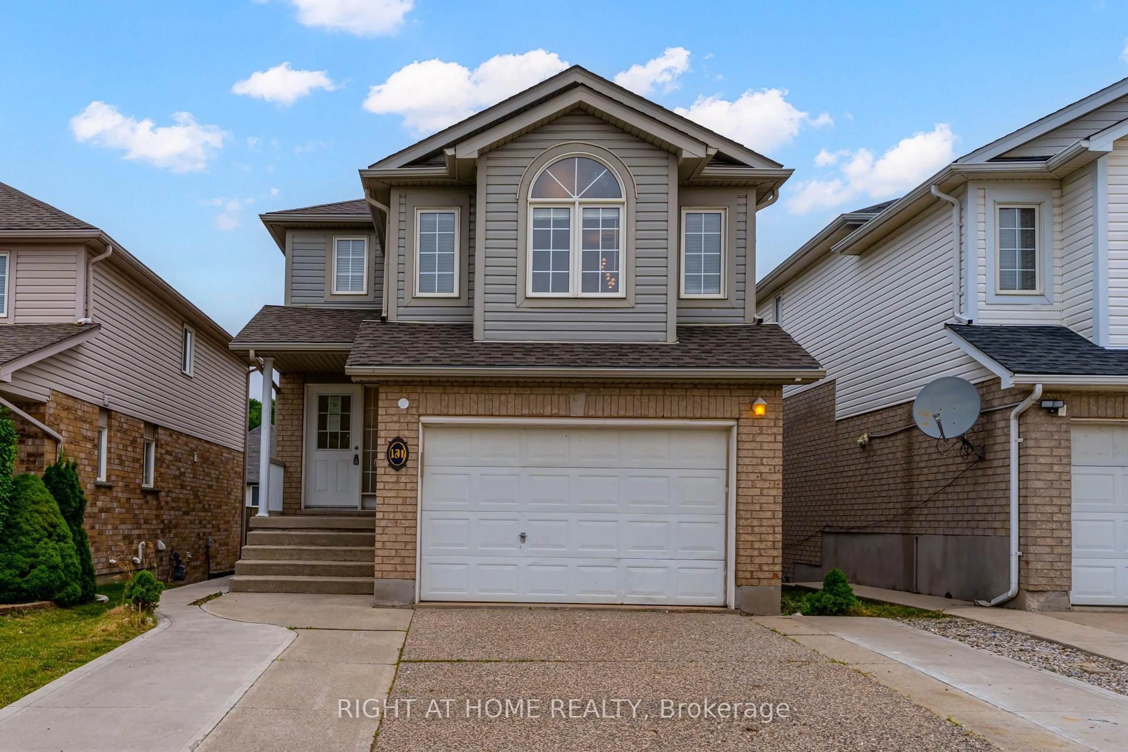 Home with brick exterior material, street for 131 Peach Blossom Cres, Kitchener Ontario N2E 3Z7