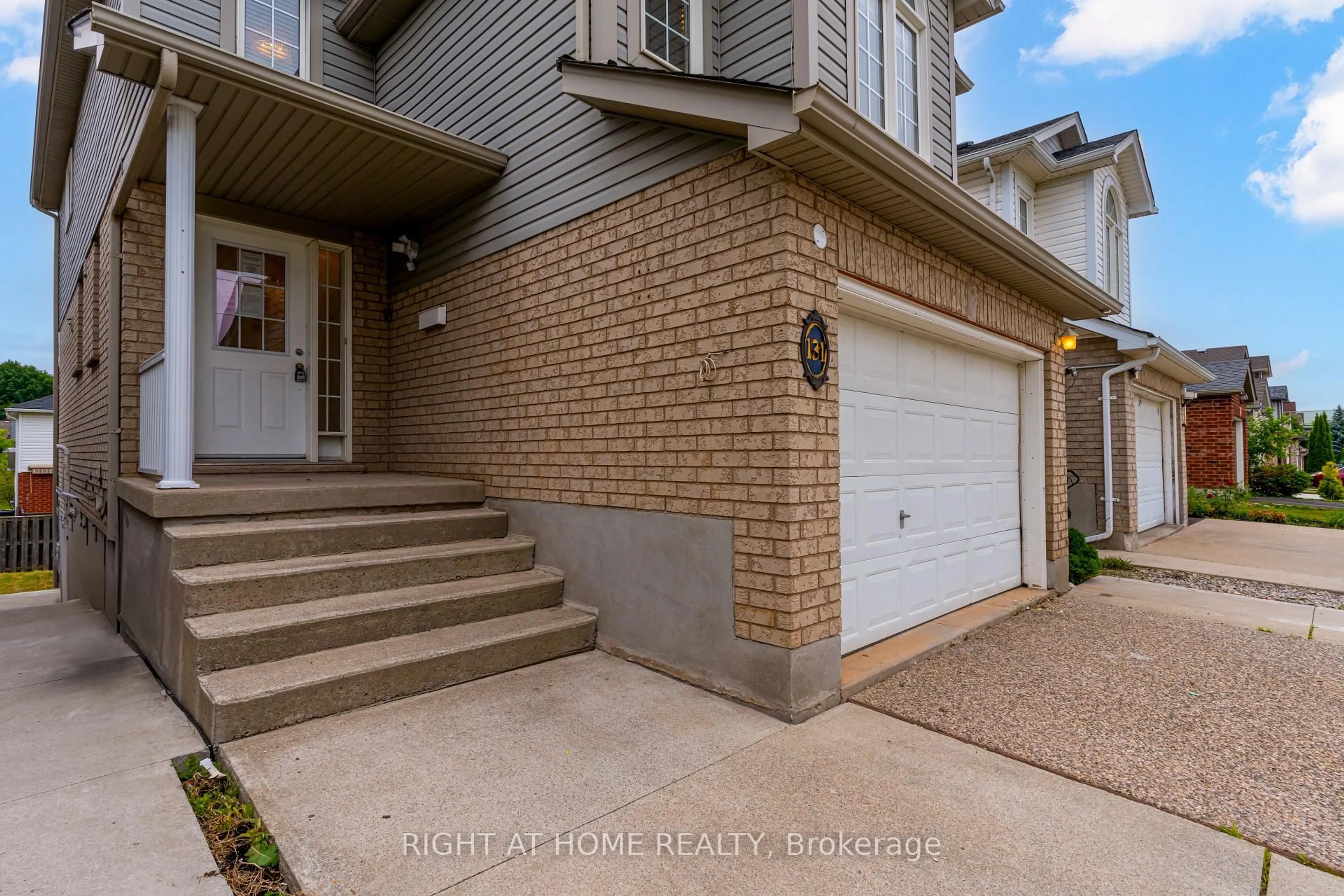 Home with brick exterior material, street for 131 Peach Blossom Cres, Kitchener Ontario N2E 3Z7