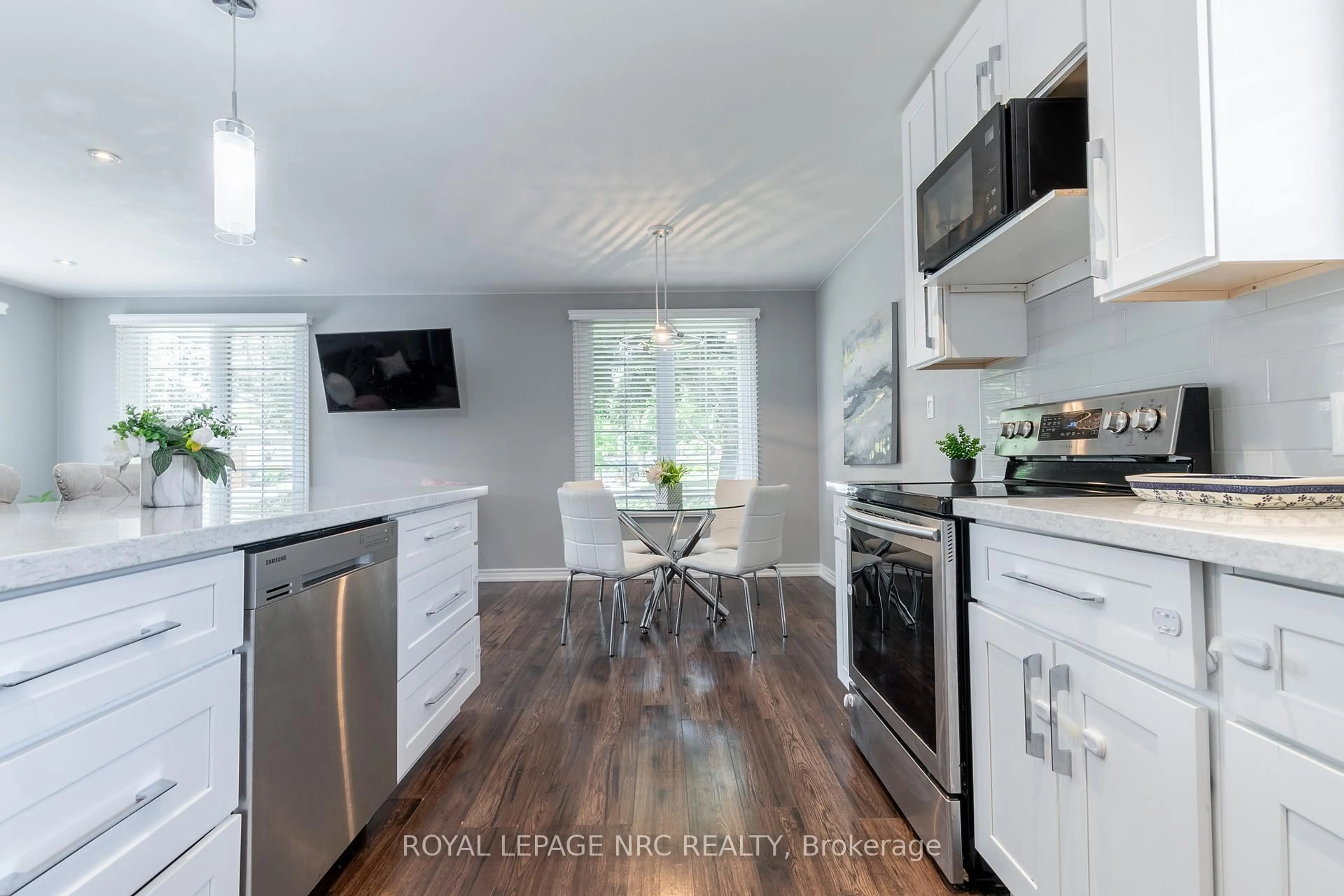 Open concept kitchen, wood/laminate floor for 56 Pearce Ave, St. Catharines Ontario L2M 6N4