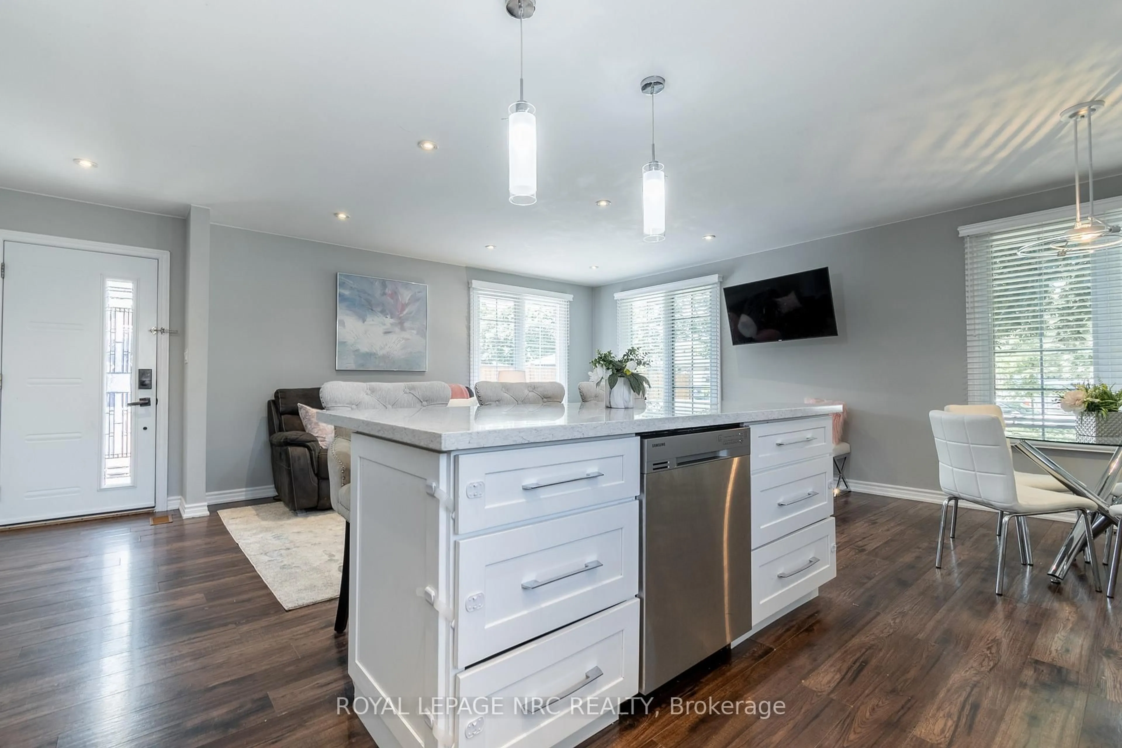 Open concept kitchen, wood/laminate floor for 56 Pearce Ave, St. Catharines Ontario L2M 6N4