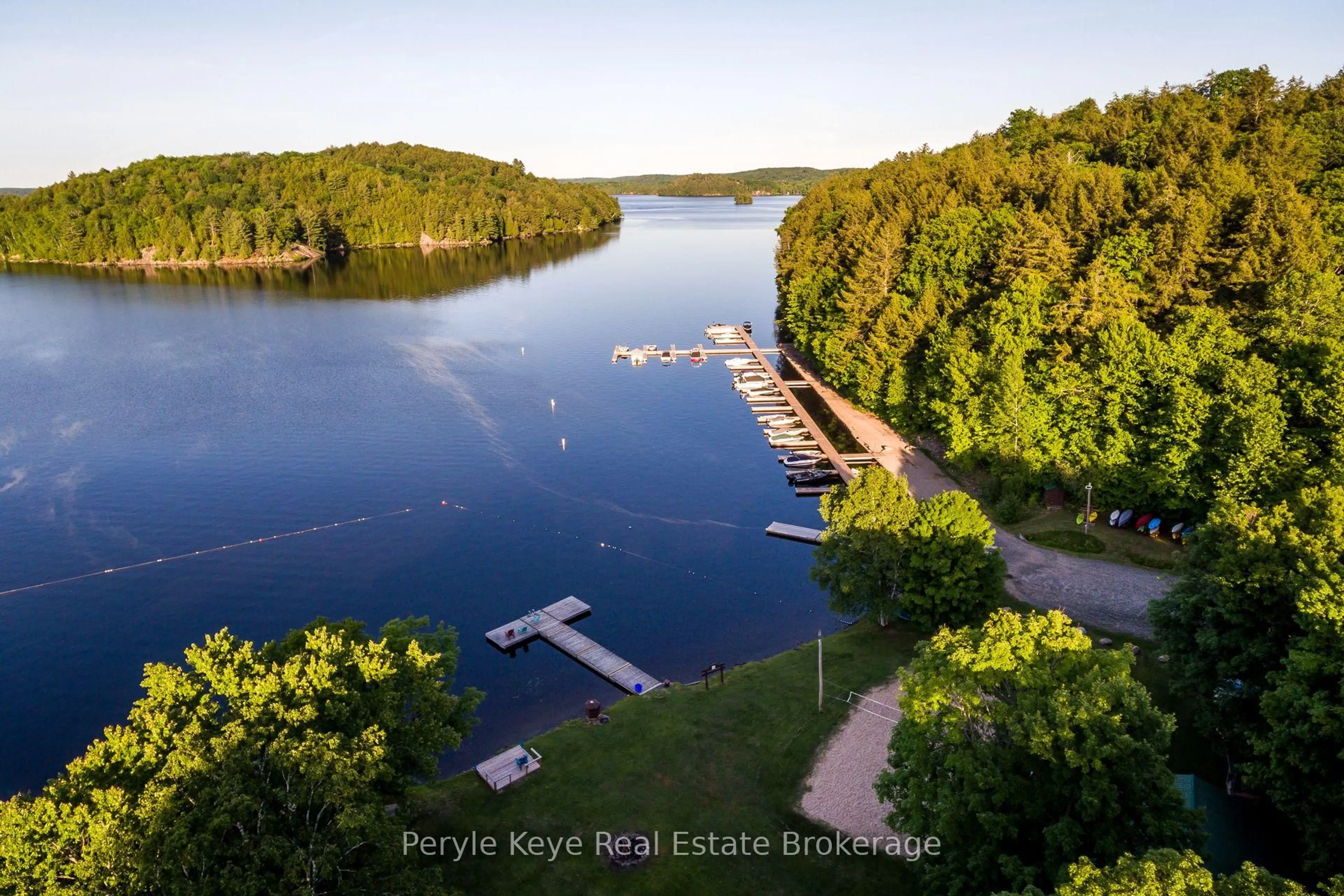 A pic from outside/outdoor area/front of a property/back of a property/a pic from drone, water/lake/river/ocean view for 6 & 8 Brennan Circ, Huntsville Ontario P1L 2J2
