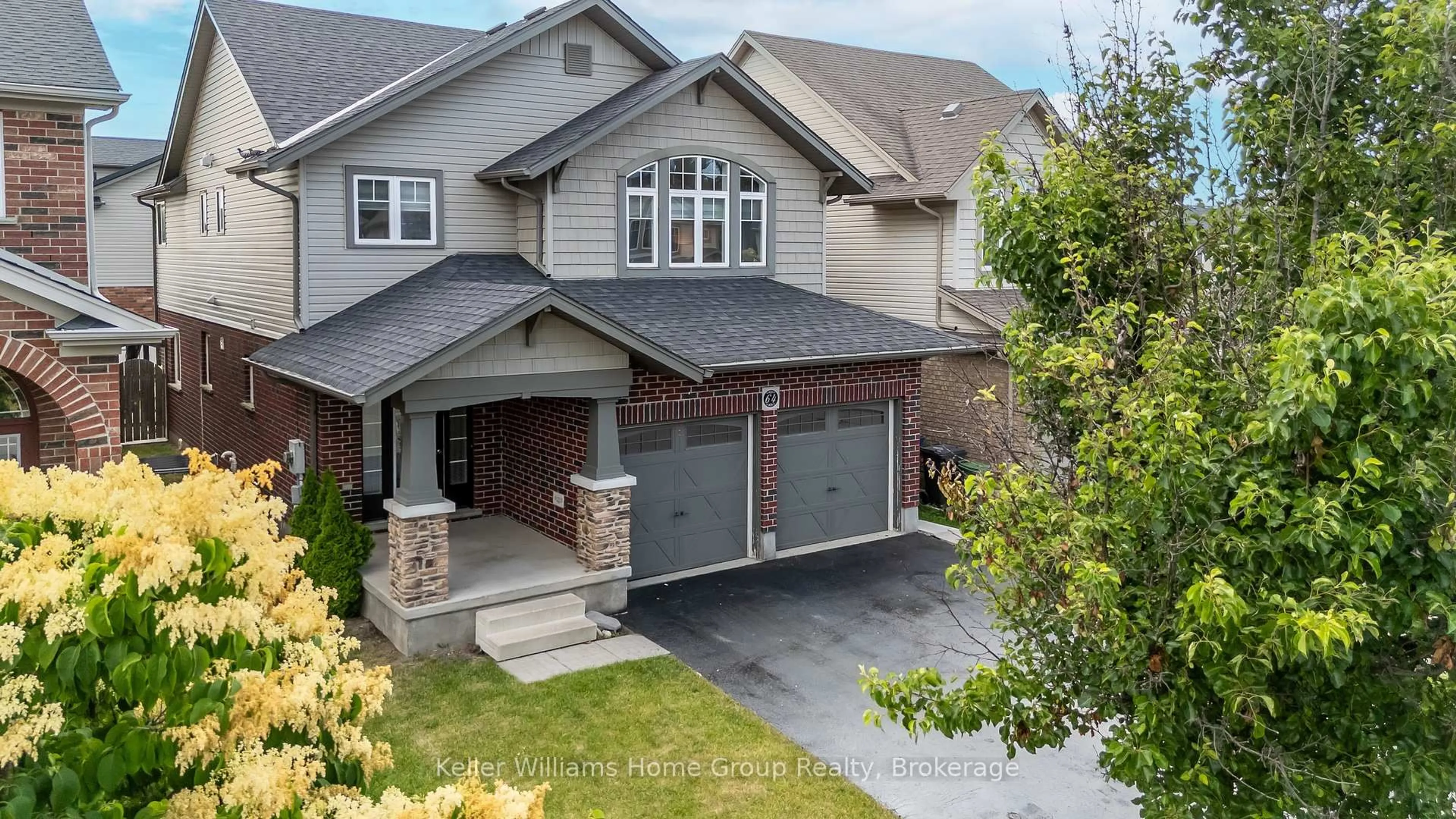 Home with brick exterior material, street for 64 Laughland Lane, Guelph Ontario N1L 0C6