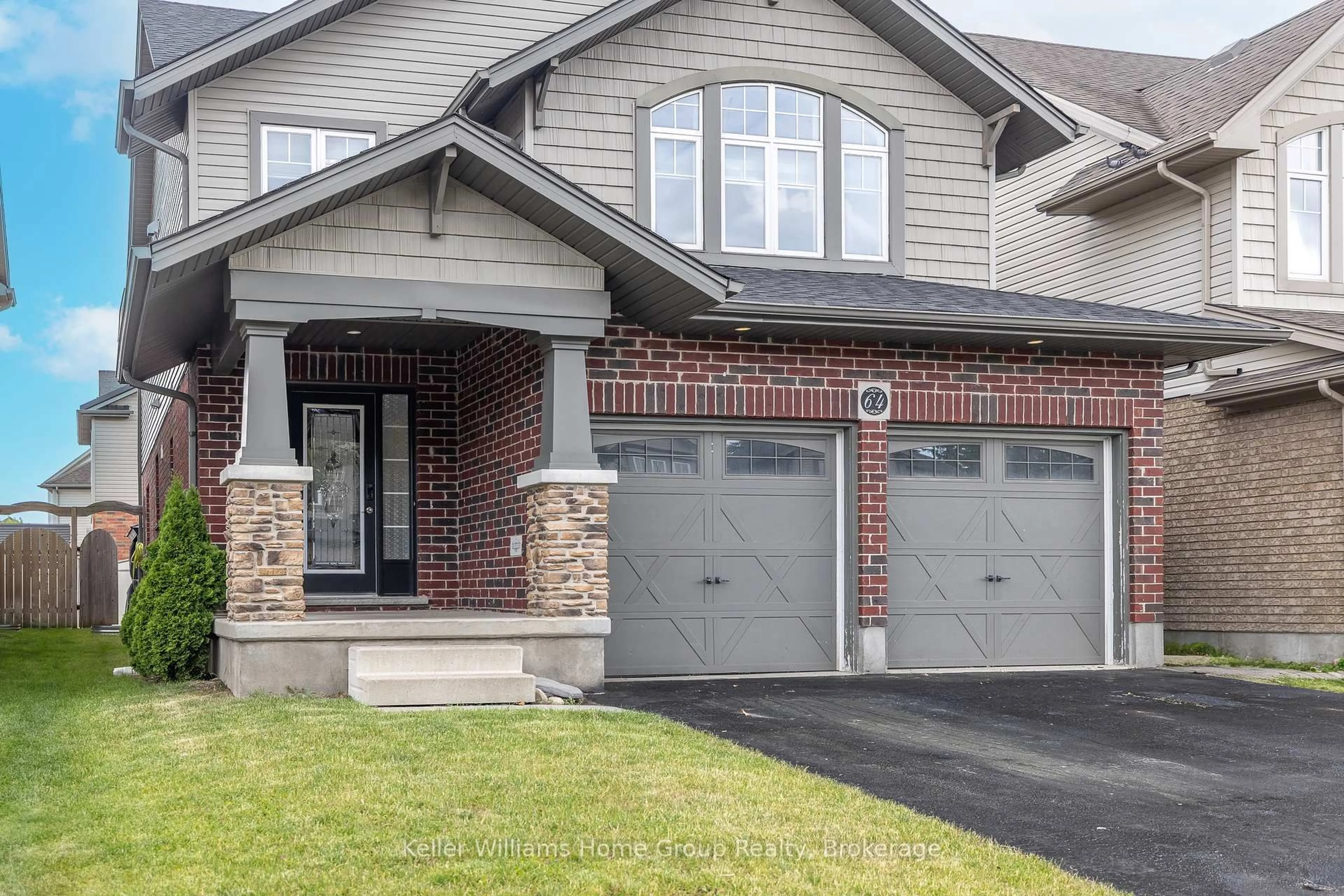 Home with brick exterior material, street for 64 Laughland Lane, Guelph Ontario N1L 0C6